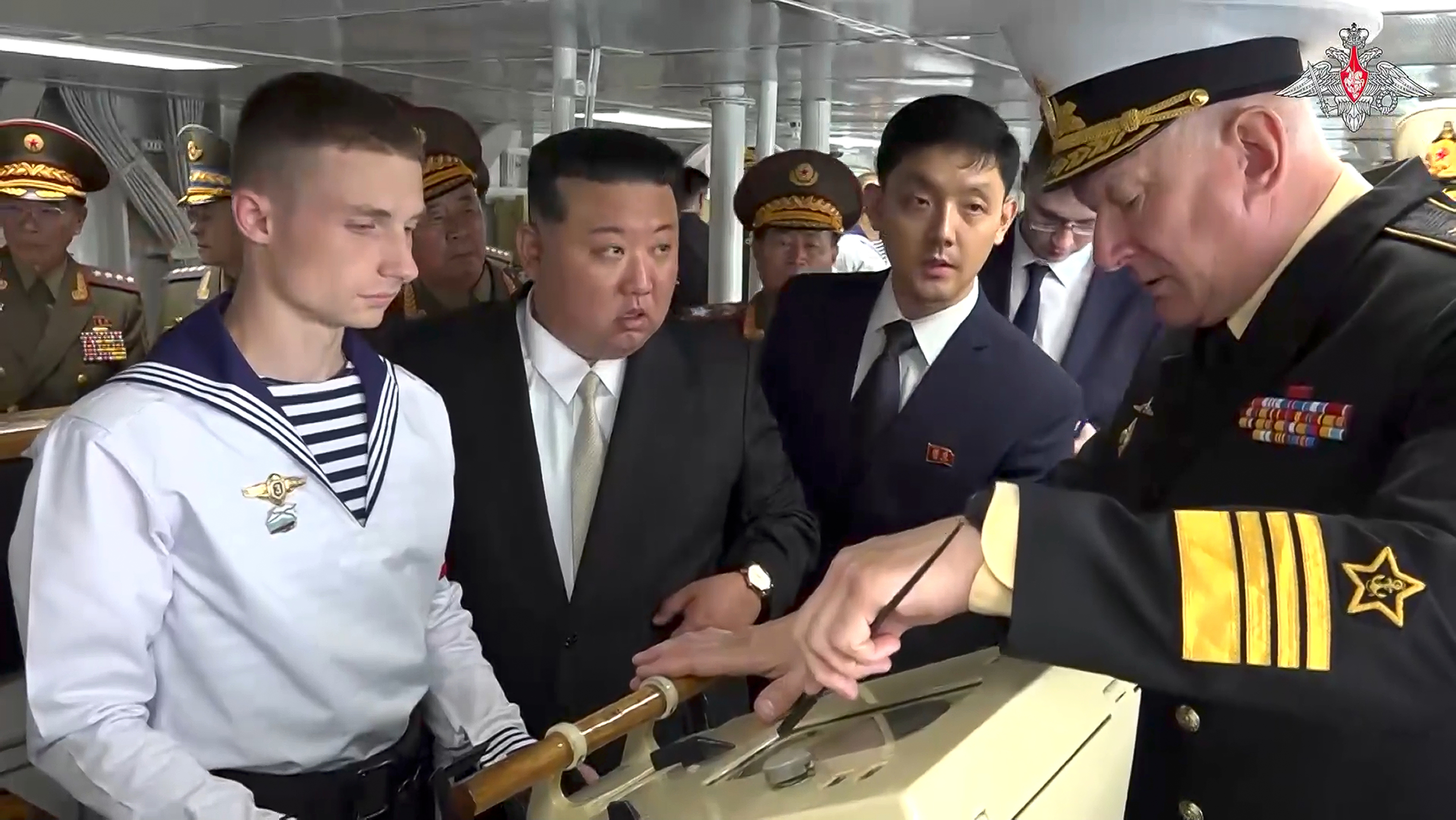 North Korea's leader Kim Jong Un, centre, listens to explanations by Admiral Nikolai Yevmenov, Commander-in-Chief of the Russian Navy, right, while visiting the Admiral Shaposhnikov frigate of the Russian navy in the port of Vladivostok. Photo / AP