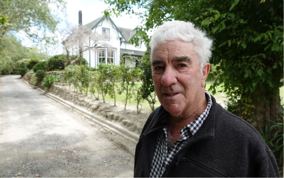 Rowley Powdrell is working to clear silt from his property. Photo / Jimmy Ellingham / RNZ