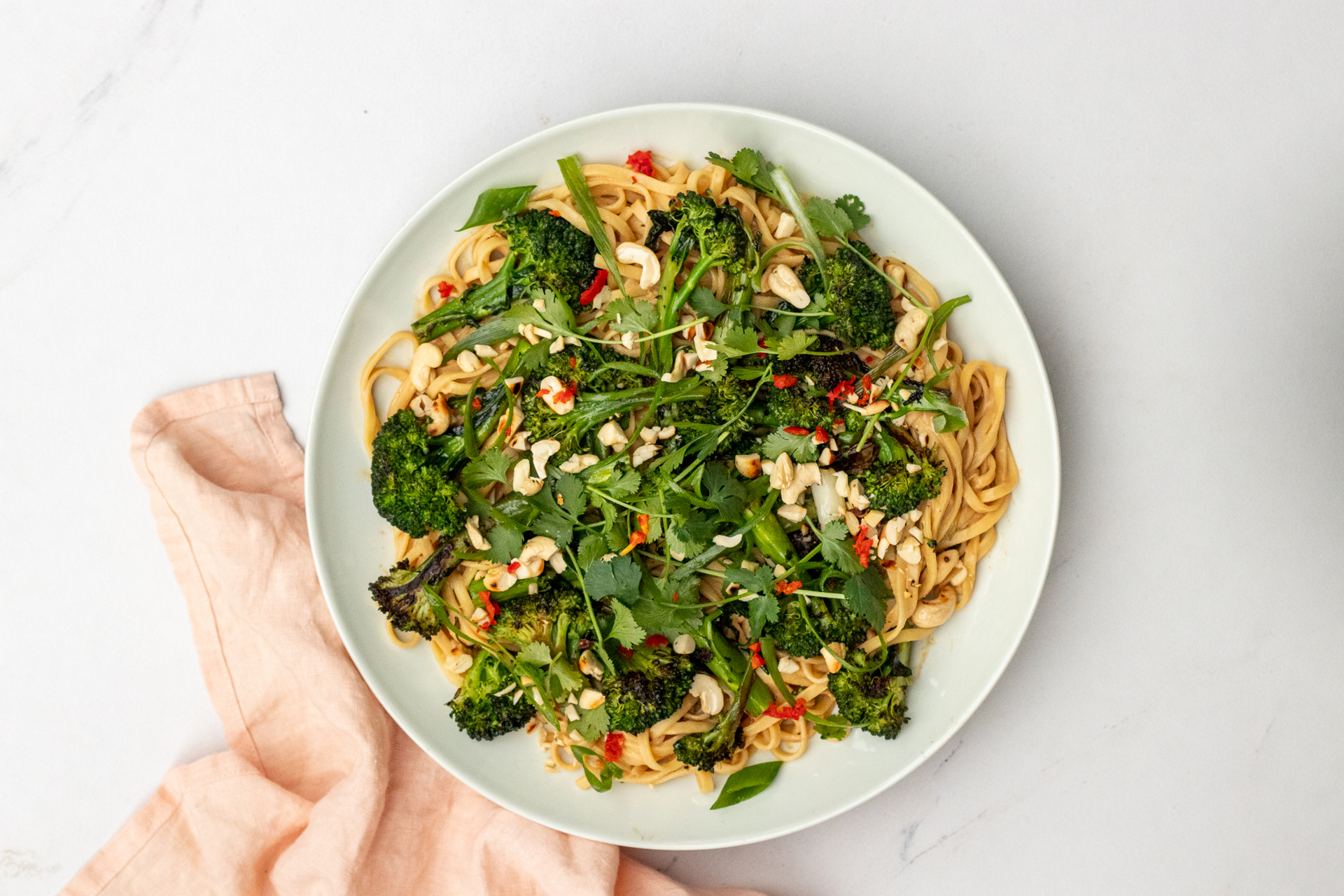 Peanut and miso noodles with stir-fried broccolini. Photo / Supplied