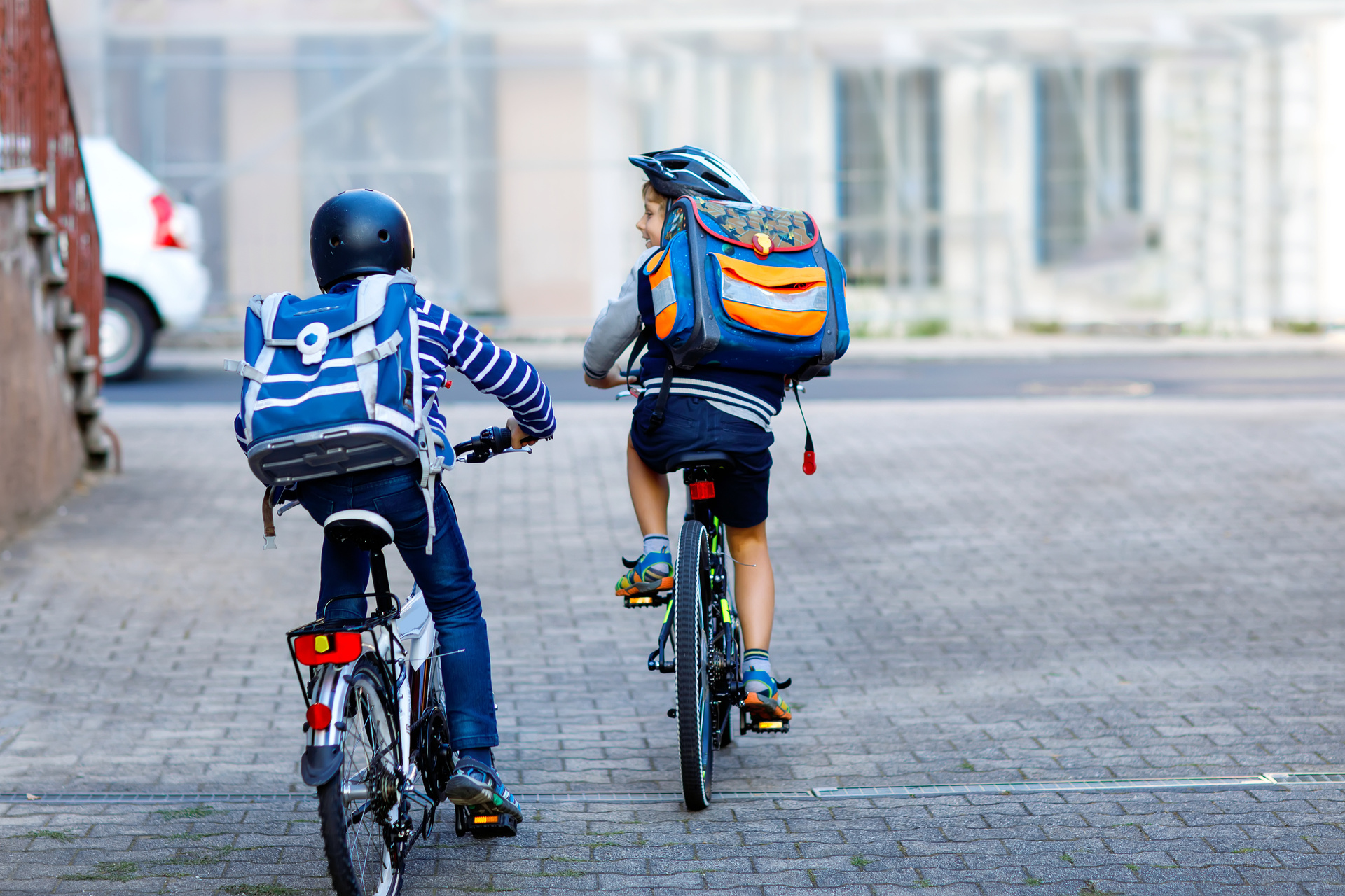 Two children on their way to school by bicycle. Is it bad for a state agency to encourage this?