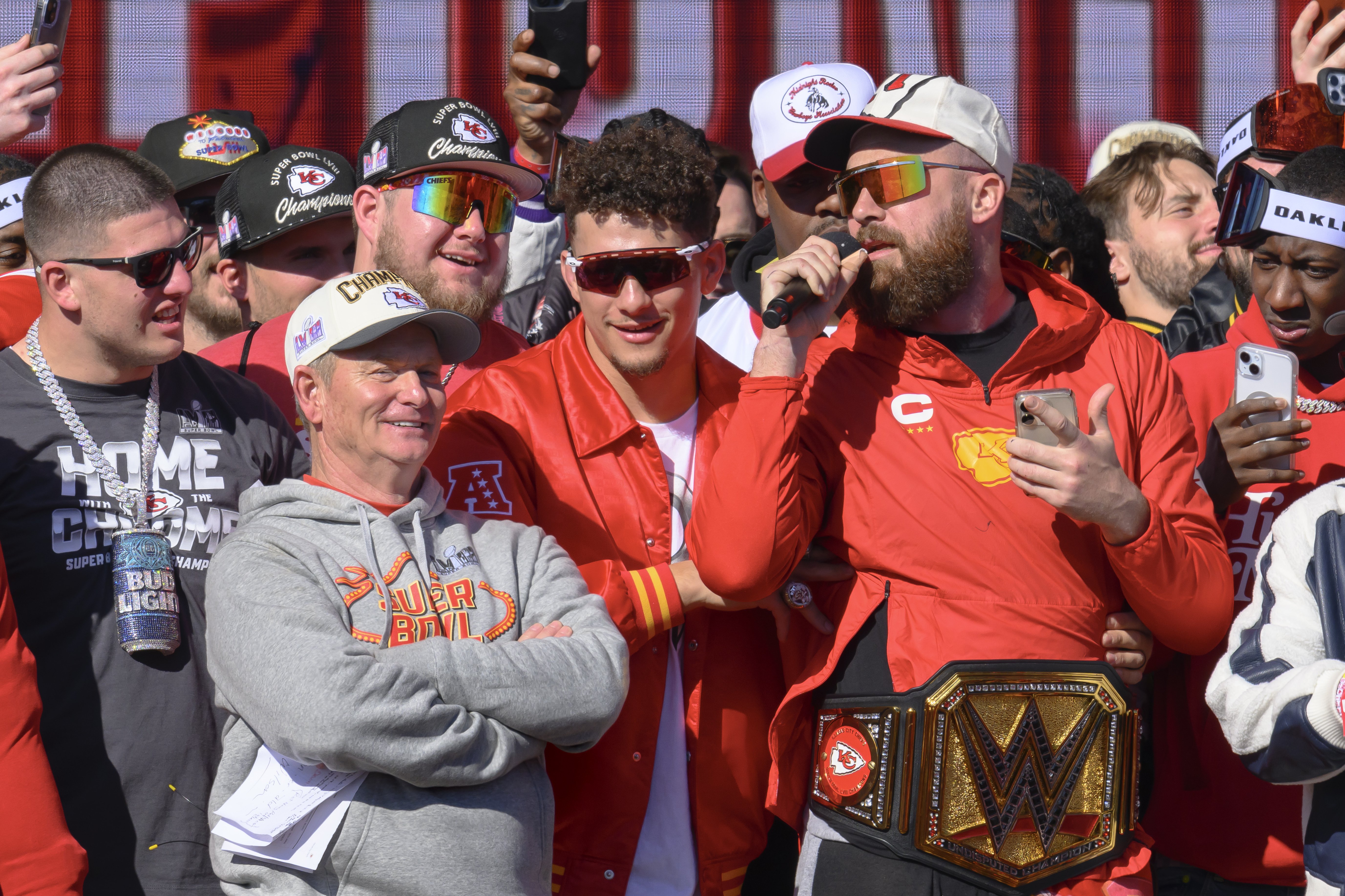 Kansas City Chiefs tight end Travis Kelce, right, serenades the crowd, as Patrick Mahomes, second from right, and teammates look on. Photo / AP