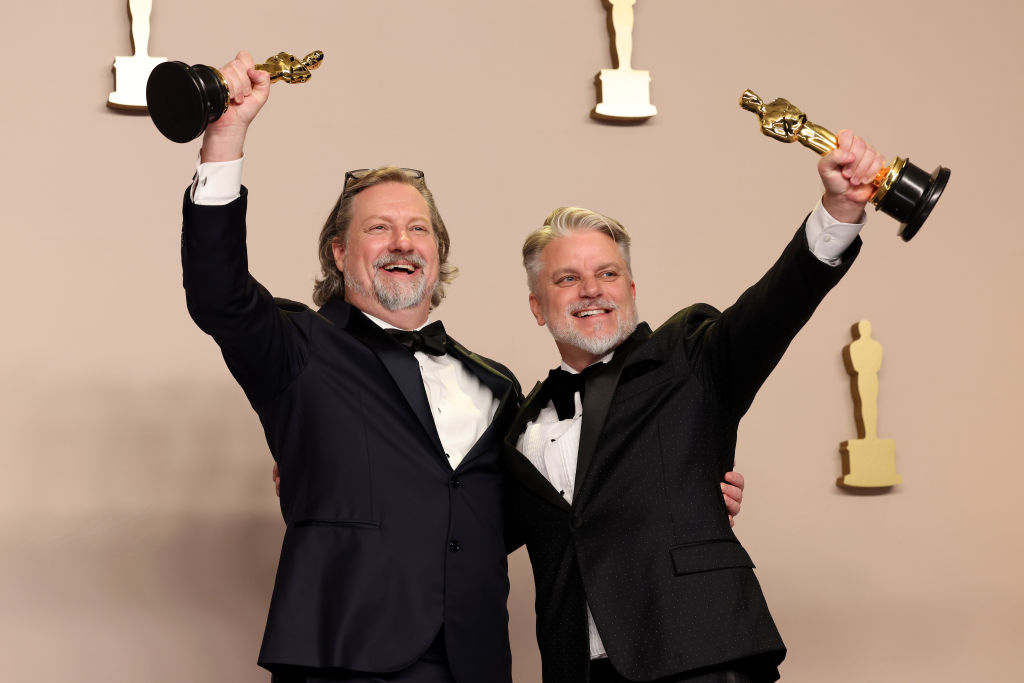 HOLLYWOOD, CALIFORNIA - MARCH 10: (L-R) Dave Mullins and Brad Booker, winner of the Best Animated Short Film for “War is Over! Inspired by the Music of John & Yoko”, pose in the press room during the 96th Annual Academy Awards at Ovation Hollywood on March 10, 2024 in Hollywood, California. (Photo by John Shearer/WireImage)