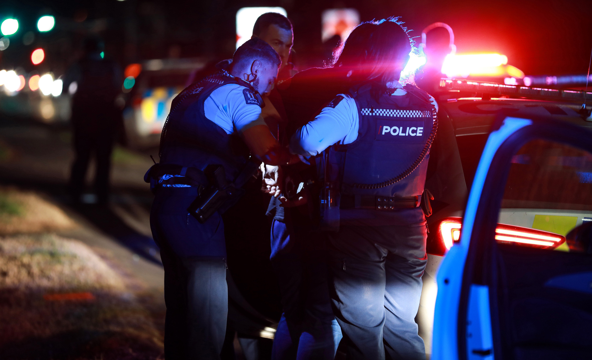 Police apprehend a suspect connected with a firearm offence in Favona, Auckland. Photo / Hayden Woodward 