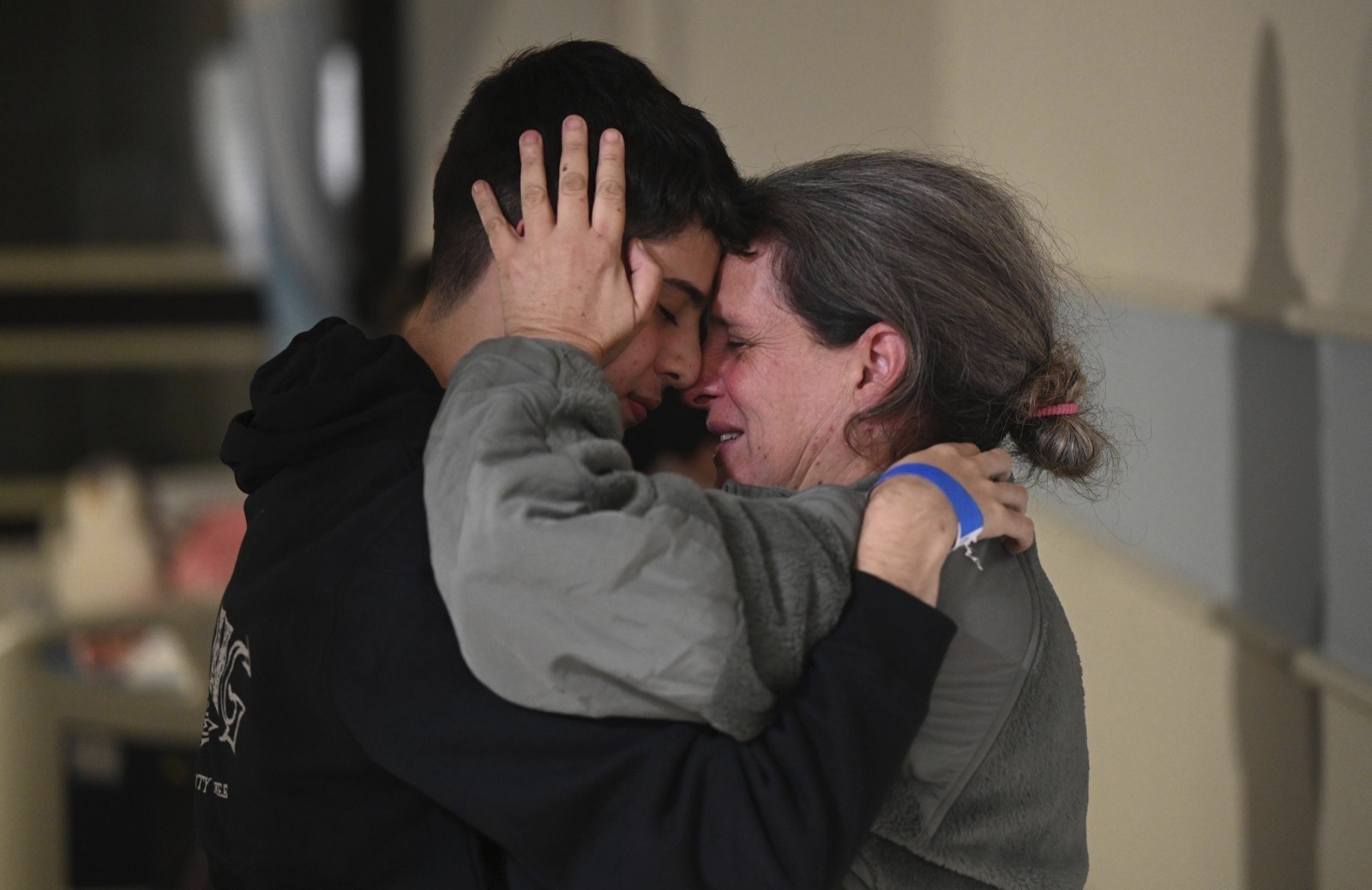 Sharon Hertzman (right) hugs a relative as they reunite at Sheba Medical Centre in Ramat Gan, Israel. Photo / AP