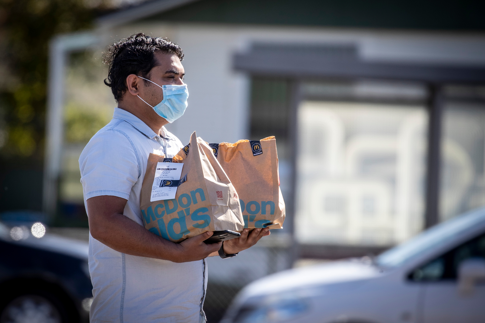 An Uber Eats delivery driver collects an order during lockdown. Photo / Michael Craig, File