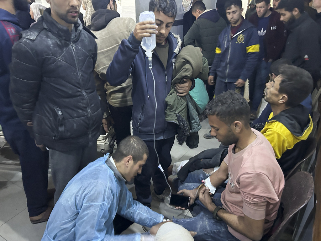 Palestinians wounded in an Israeli strike while waiting for humanitarian aid on the beach in Gaza City are treated in Shifa Hospital. Photo / AP