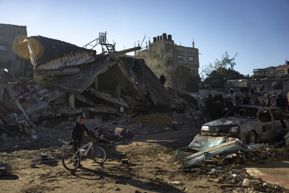 Palestinians search for bodies and survivors in the rubble of a residential building destroyed in an Israeli airstrike in Rafah, southern Gaza Strip. Photo / AP