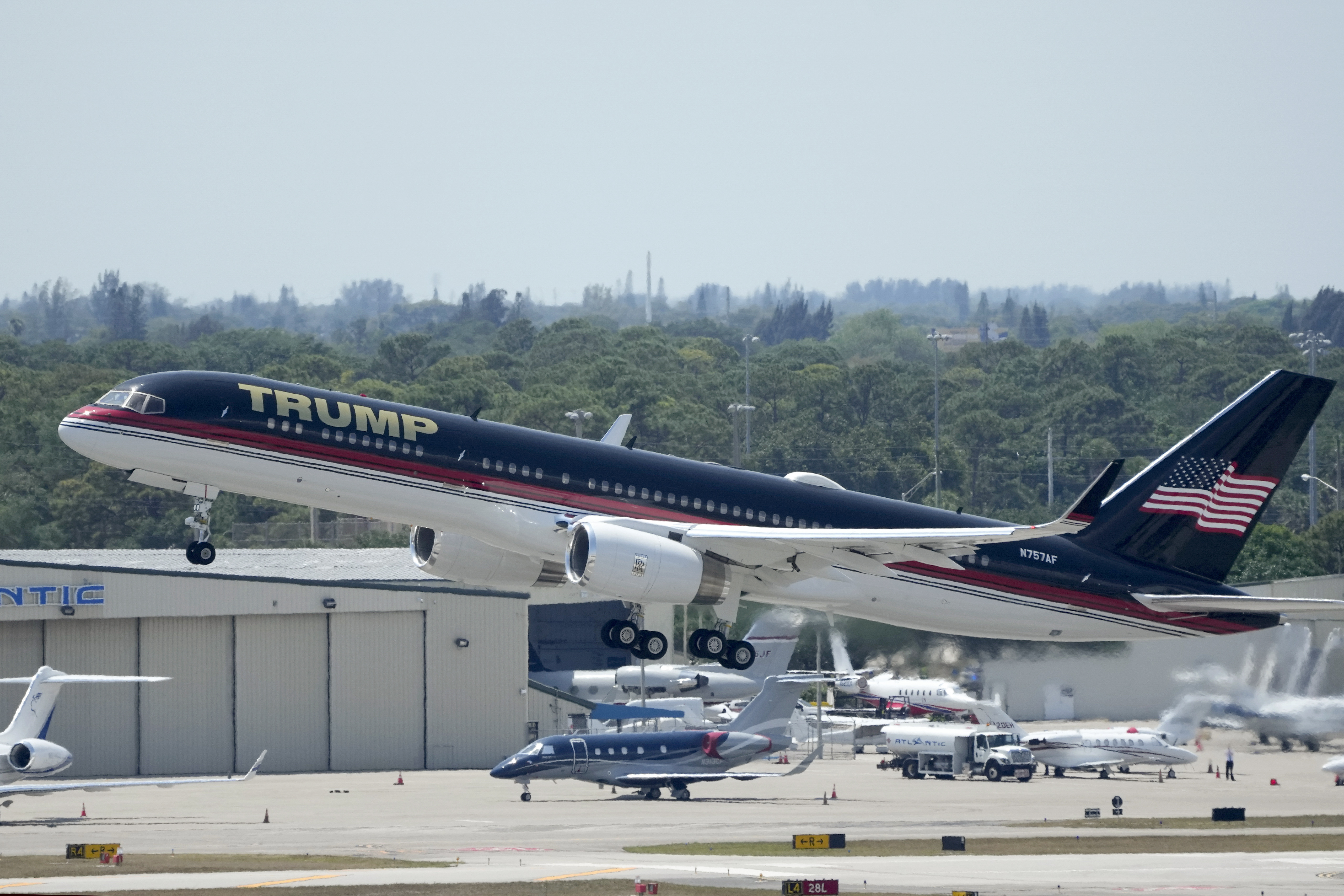 The plane carrying former president Donald Trump lifts off from Florida heading to New York. Photo / AP