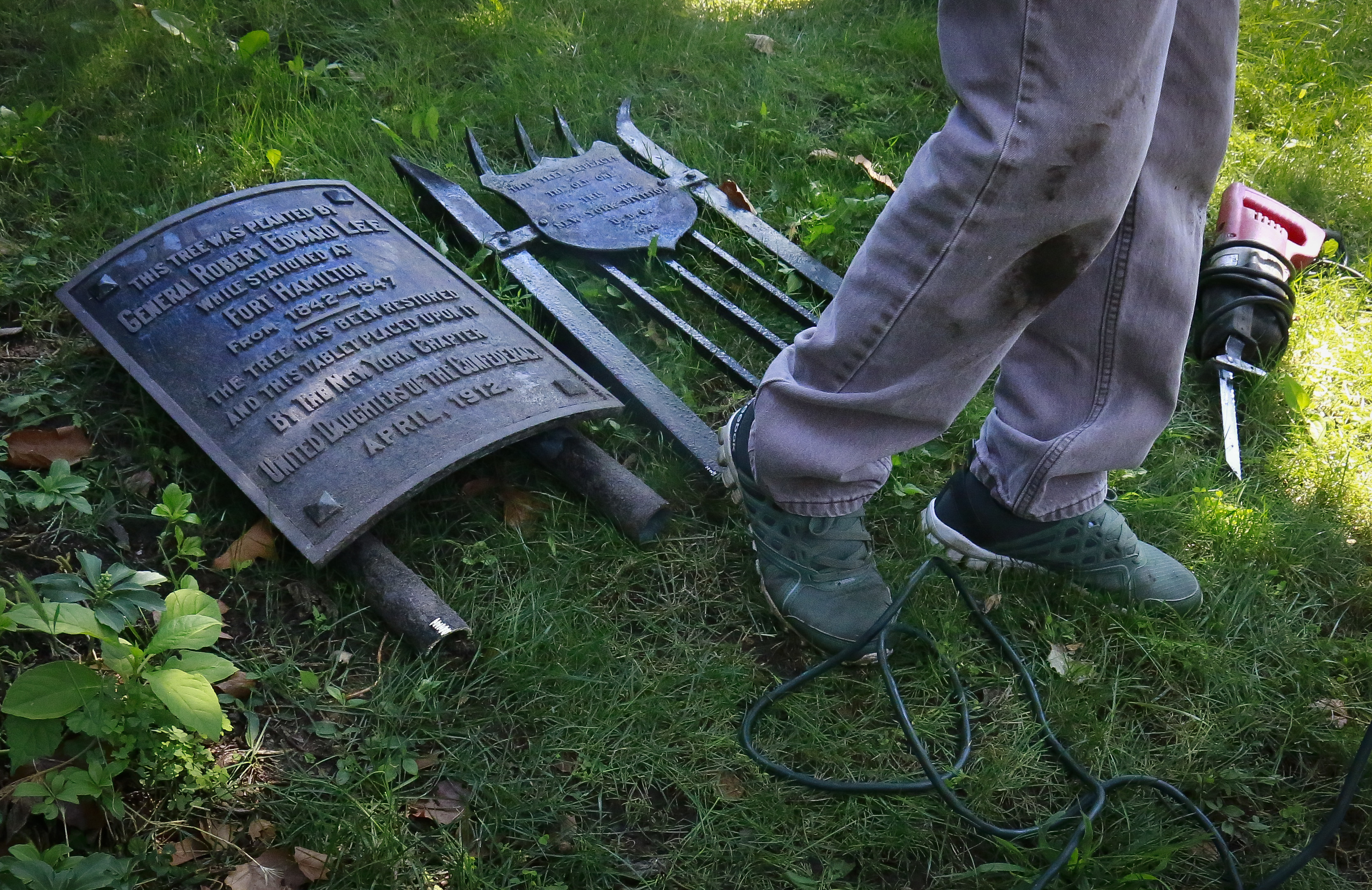 A plaque recognising confederate general Robert Lee lies on the ground after its removal from the premises of St. John's Episcopal Church in Bay Ridge, New York. Photo / AP