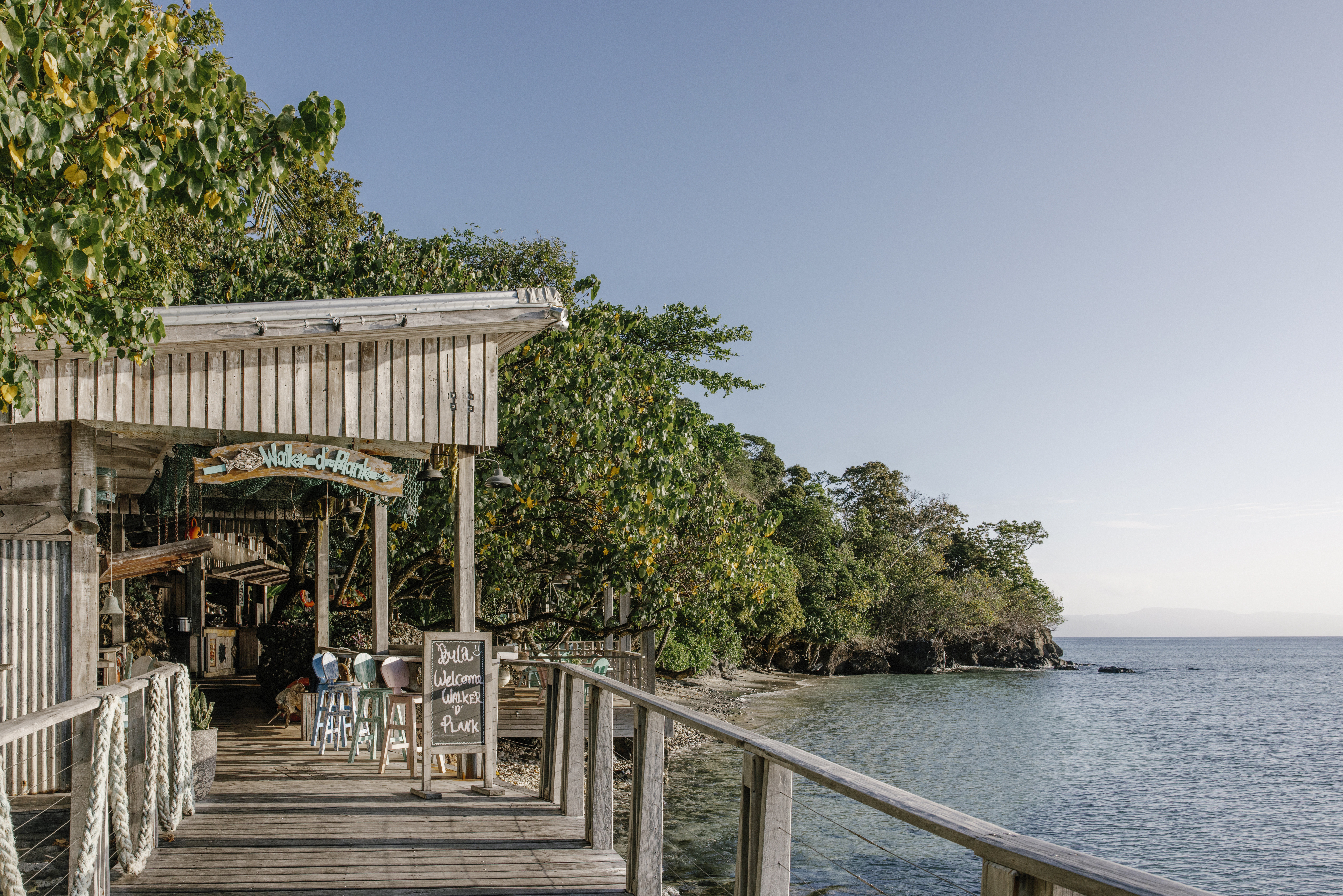 Walker D'Plank restaurant offers barefoot dining over crystal waters.