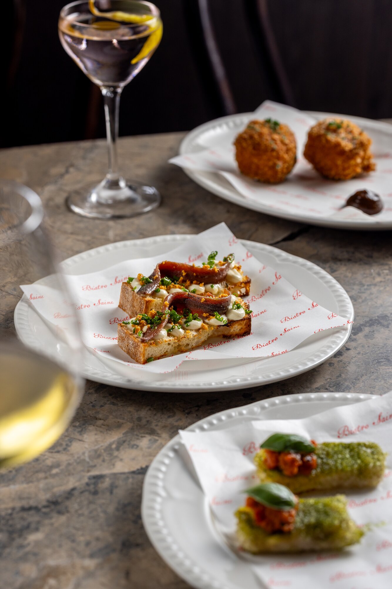Items from the snack menu, including the aubergine frites, anchovy en route and braised pork croquettes. Photo / Babiche Martens
