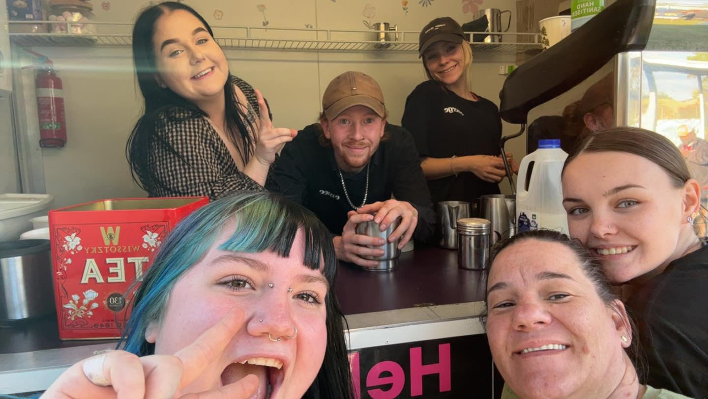 Shaw (bottom right) and some of her kids running their food truck. Photo / Emerge