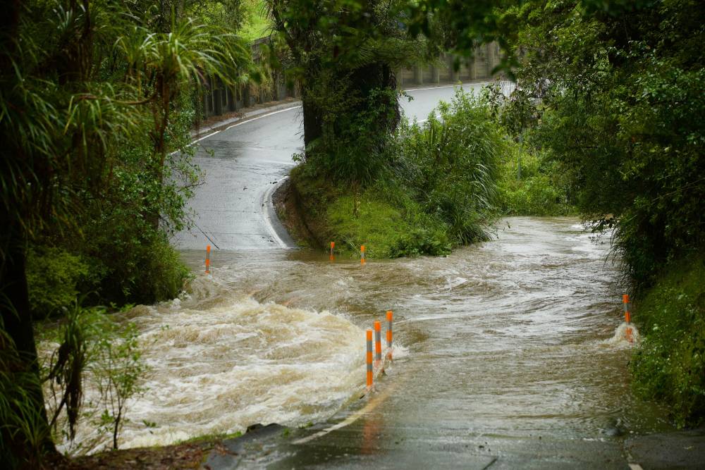The swollen ford on Falls Rd, Warkworth. A man and his vehicle are missing after being washed away at the crossing on Wednesday morning. Photo / Jason Dorday
