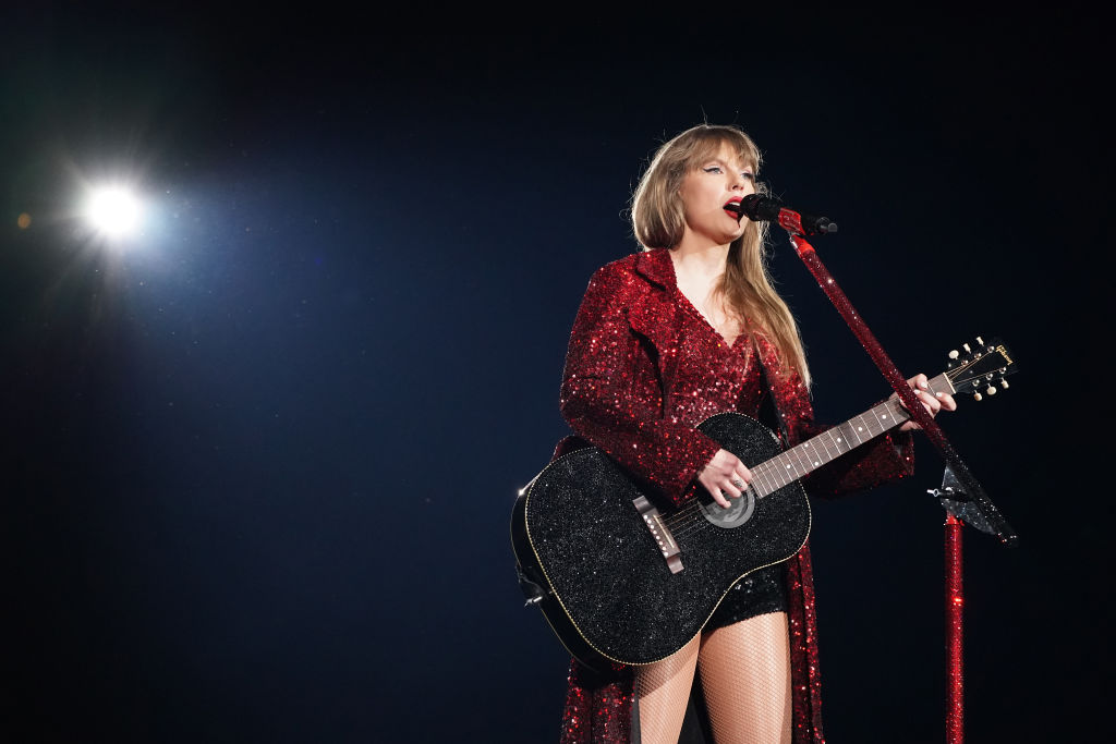 While singing All Too Well, Swift wears a long sequined coat. Photo / Getty Images