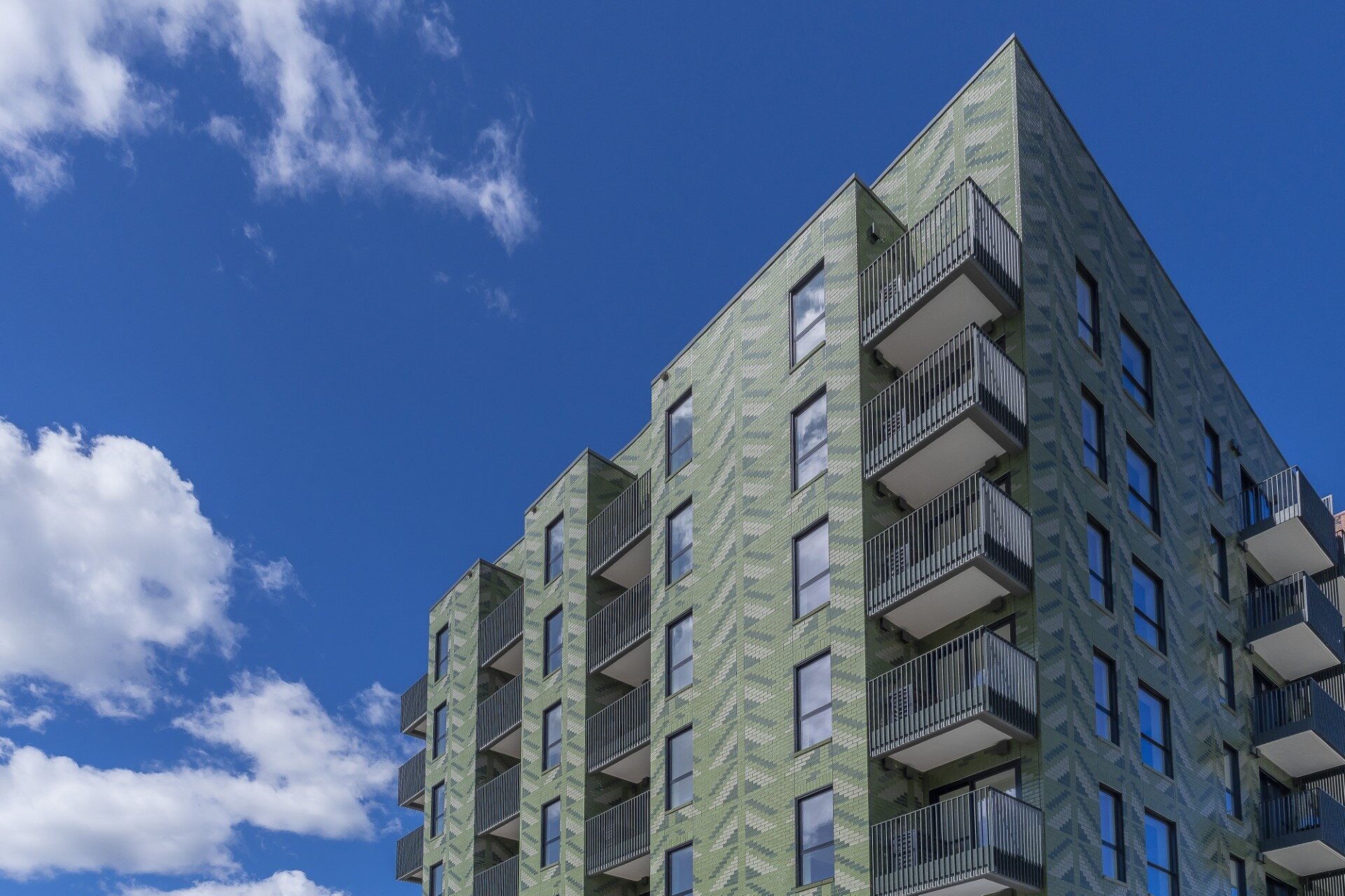  The Auckland apartment building Toi in Pt Chevalier, is a 65-unit block clad in green tiles. Photo / Ockham Residential