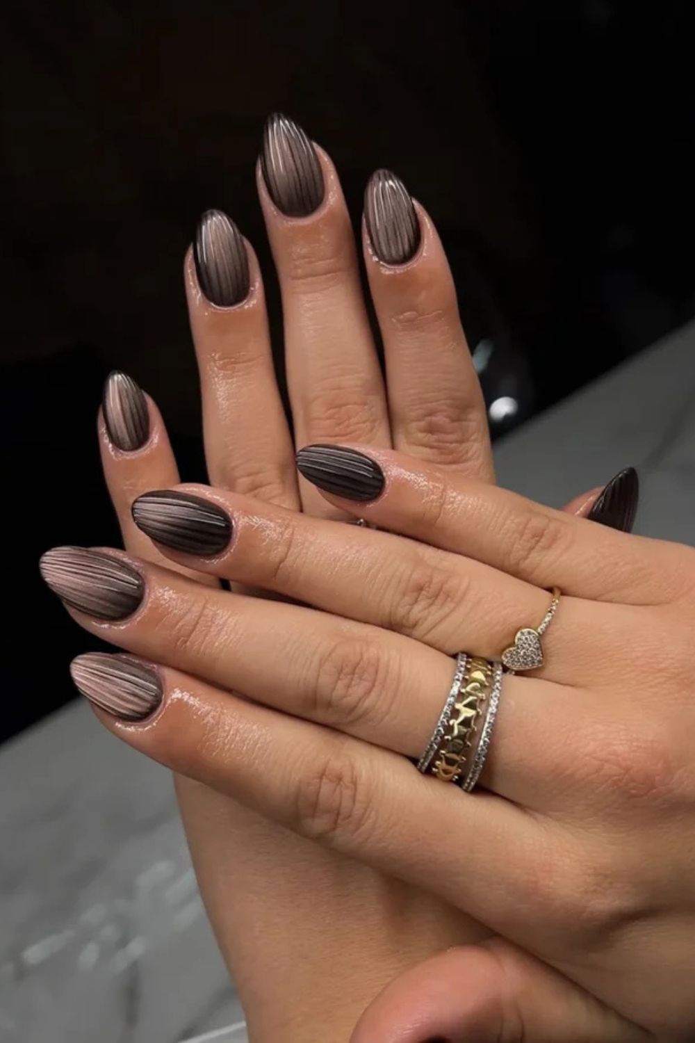 Iced coffee glass nails are one of 10 trending nail designs to request for your next manicure. Photo /  @nails_byles
