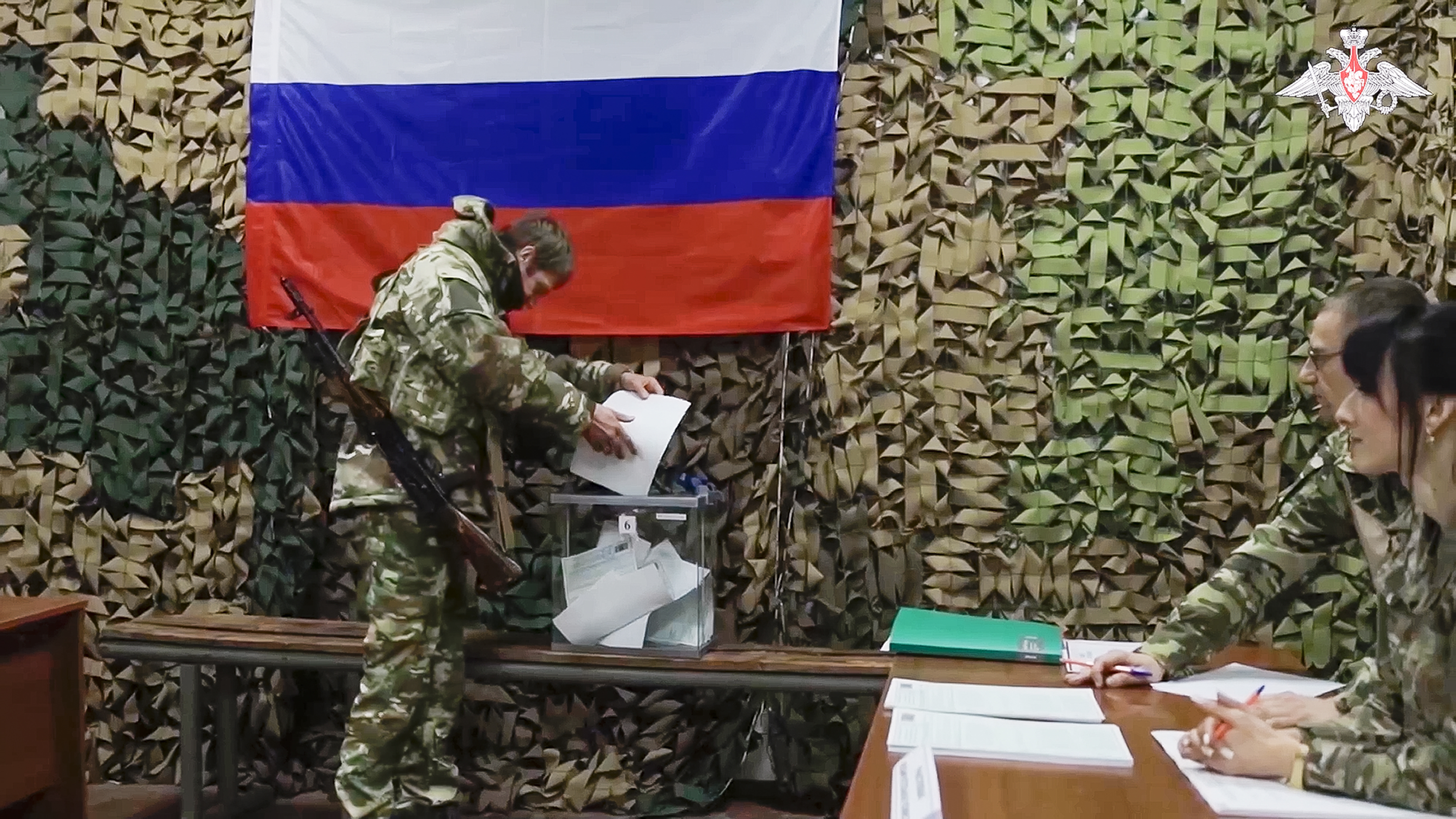 A Russian serviceman votes at an improvised polling station during early voting in the Russian presidential elections in the Russian-controlled Donetsk region, eastern Ukraine. Photo / AP