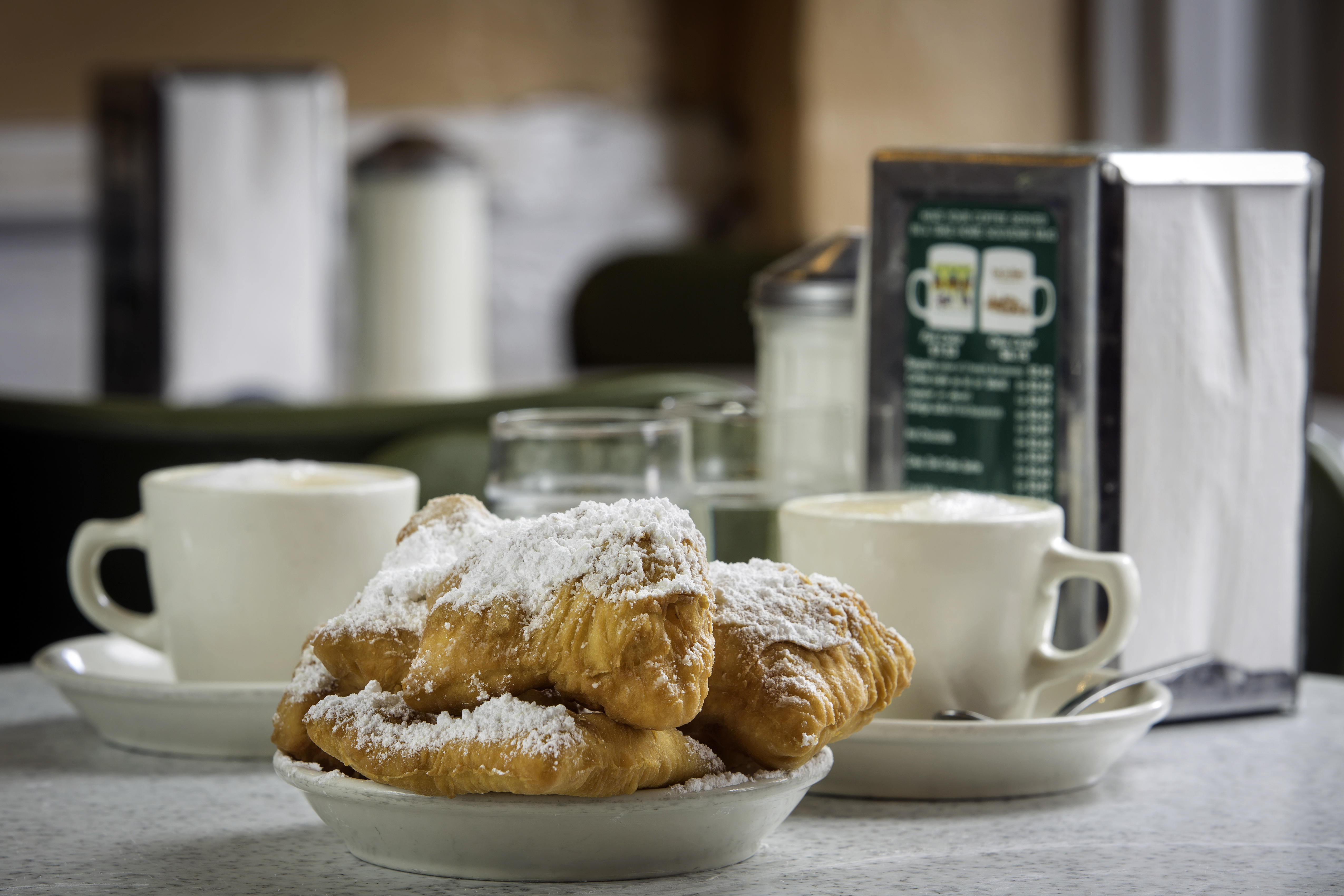Beignets are little parcels of fried dough, dusted with icing sugar. Photo / Louisiana Office of Tourism