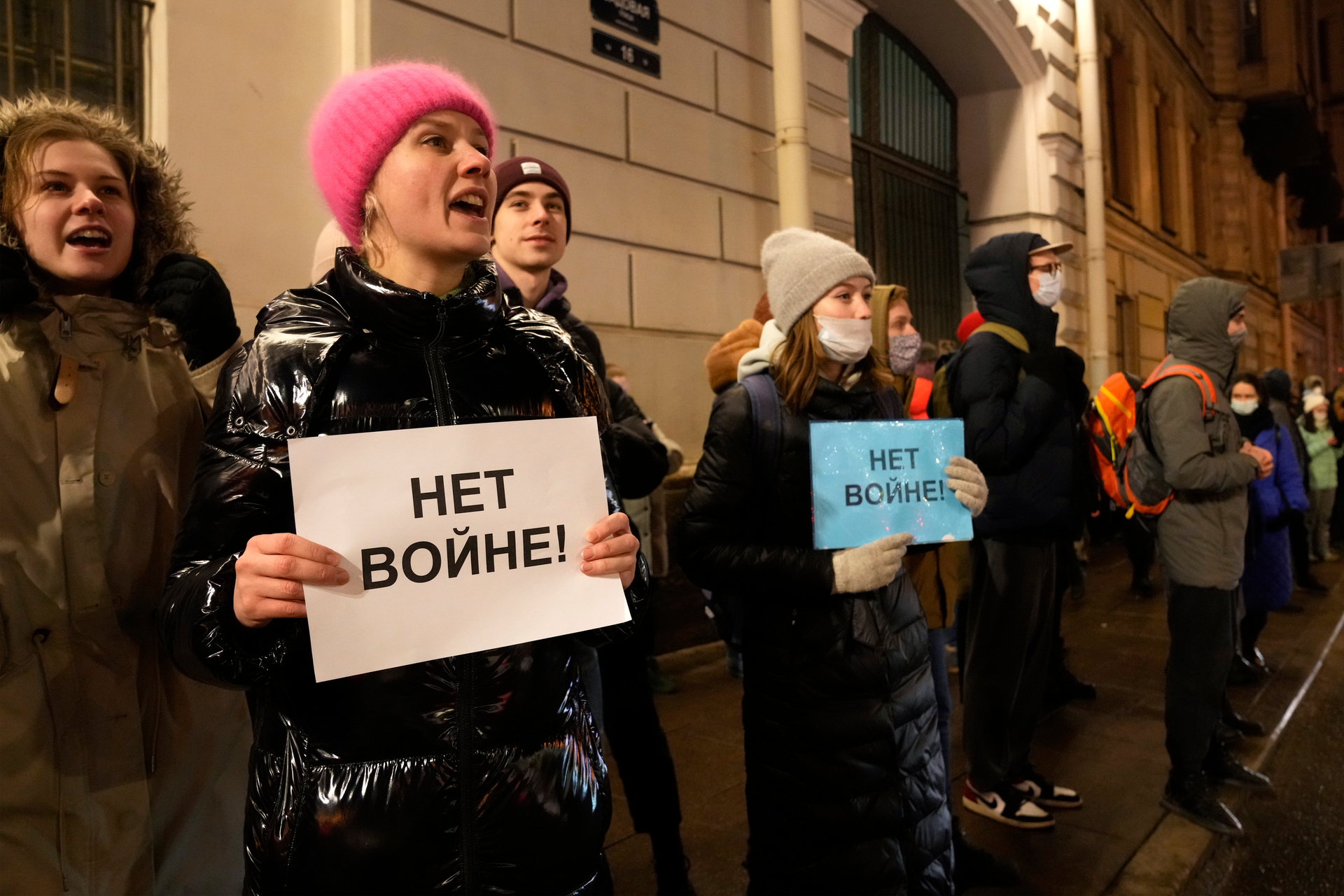 Protesters hold signs asking for 'No War'. Photo / AP