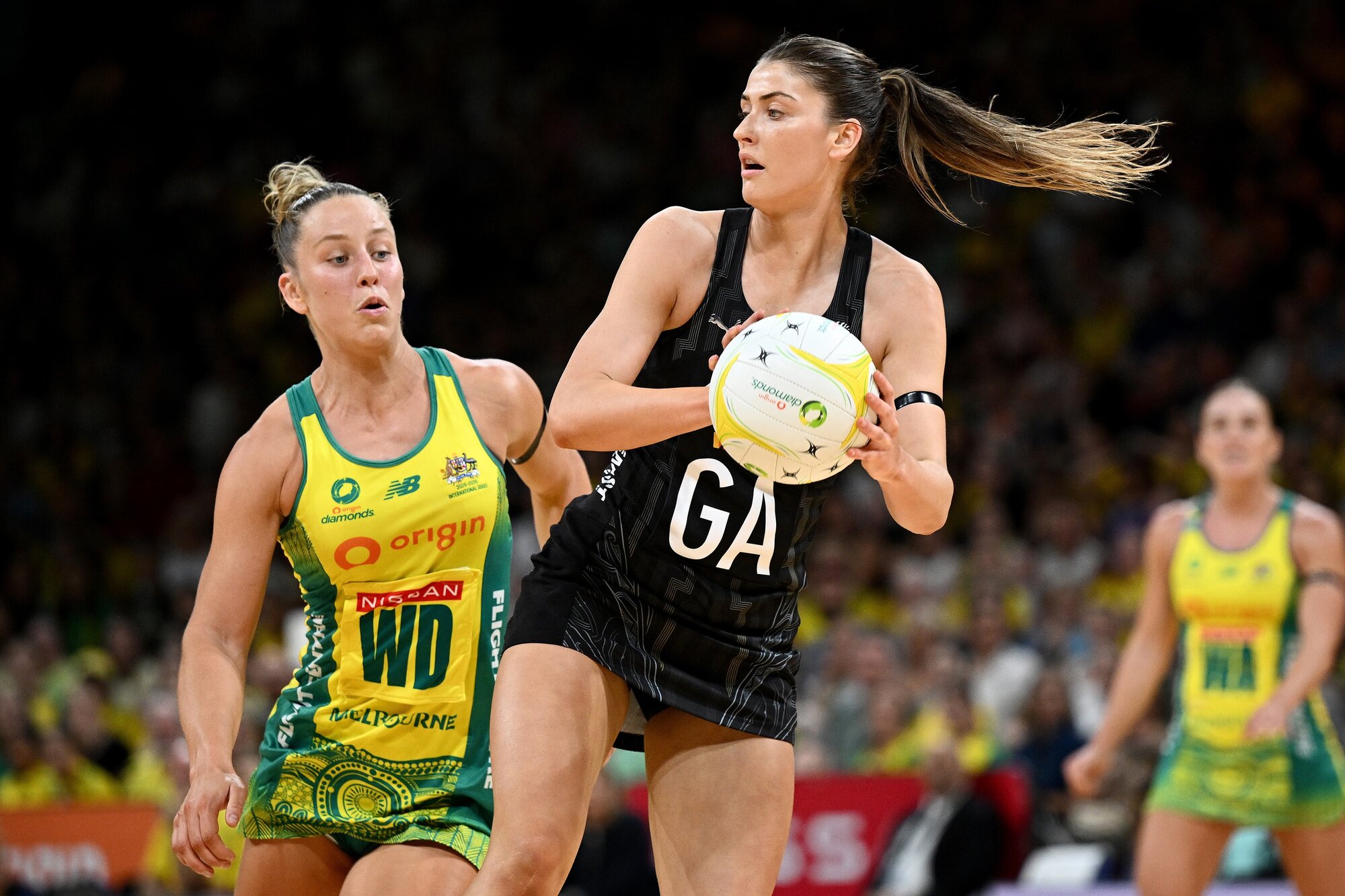 Georgia Heffernan of New Zealand looks to pass under the attention of Australia's Jamie-Lee Price during the second match of the Constellation Cup series. Photo / Photosport