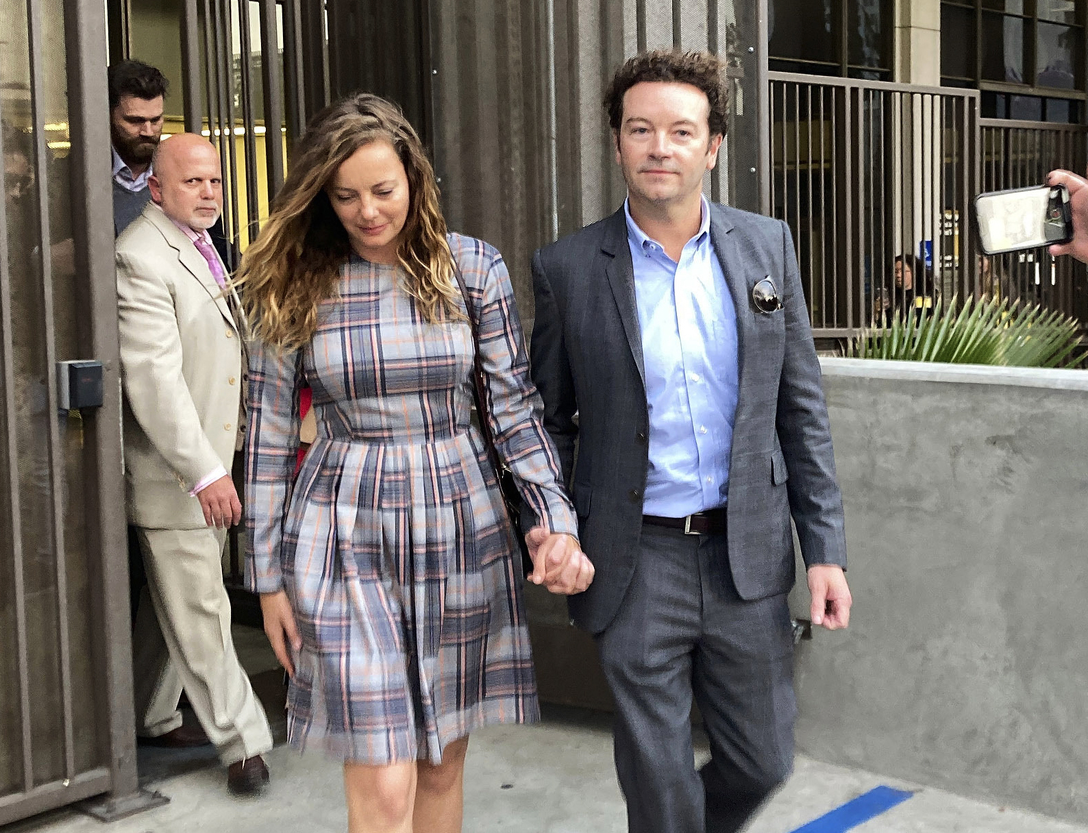 Actor Danny Masterson leaves Los Angeles Superior Court with his wife Bijou Phillips after a judge declared a mistrial in his rape case last year. Photo / AP