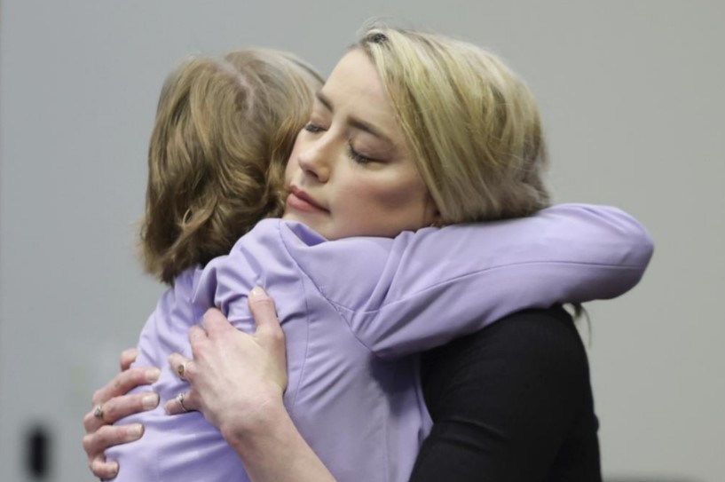 Actor Amber Heard hugs her lawyer Elaine Bredehoft after the verdict was read at the Fairfax County Circuit Courthouse. Photo / AP