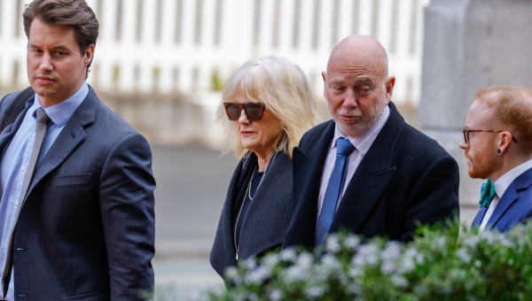 Philip Polkinghorne arrives at the Auckland High Court on Thursday morning with his lawyer Harrison Smith, sister Ruth Hughes and son Taine. Photo / Michael Craig