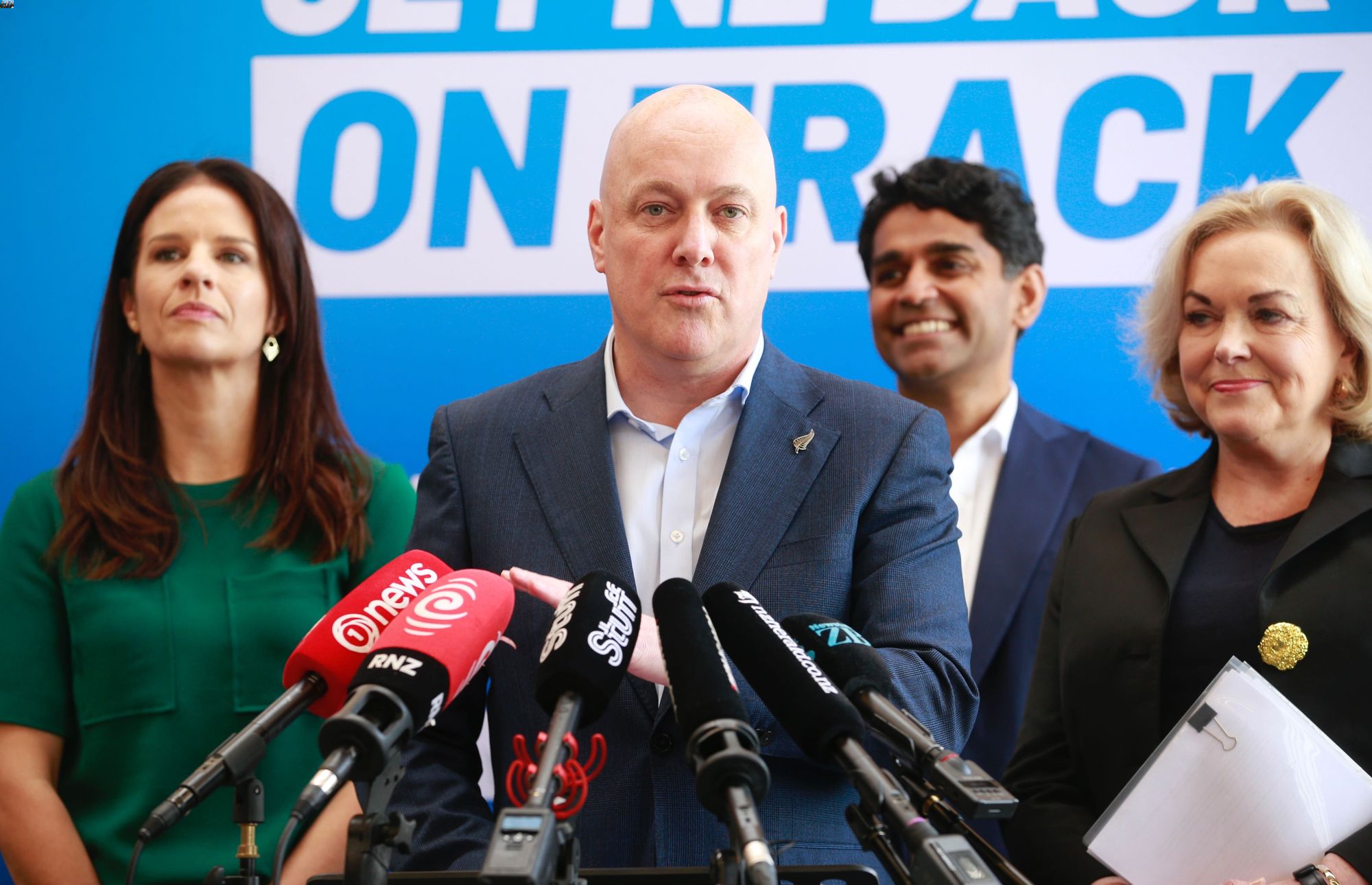 National Party leader Christopher Luxon, with immigration spokeswoman Erica Stanford (left), technology spokeswoman Judith Collins and Auckland Central candidate Mahesh Muralidhar at a policy launch. Photo / Alex Burton