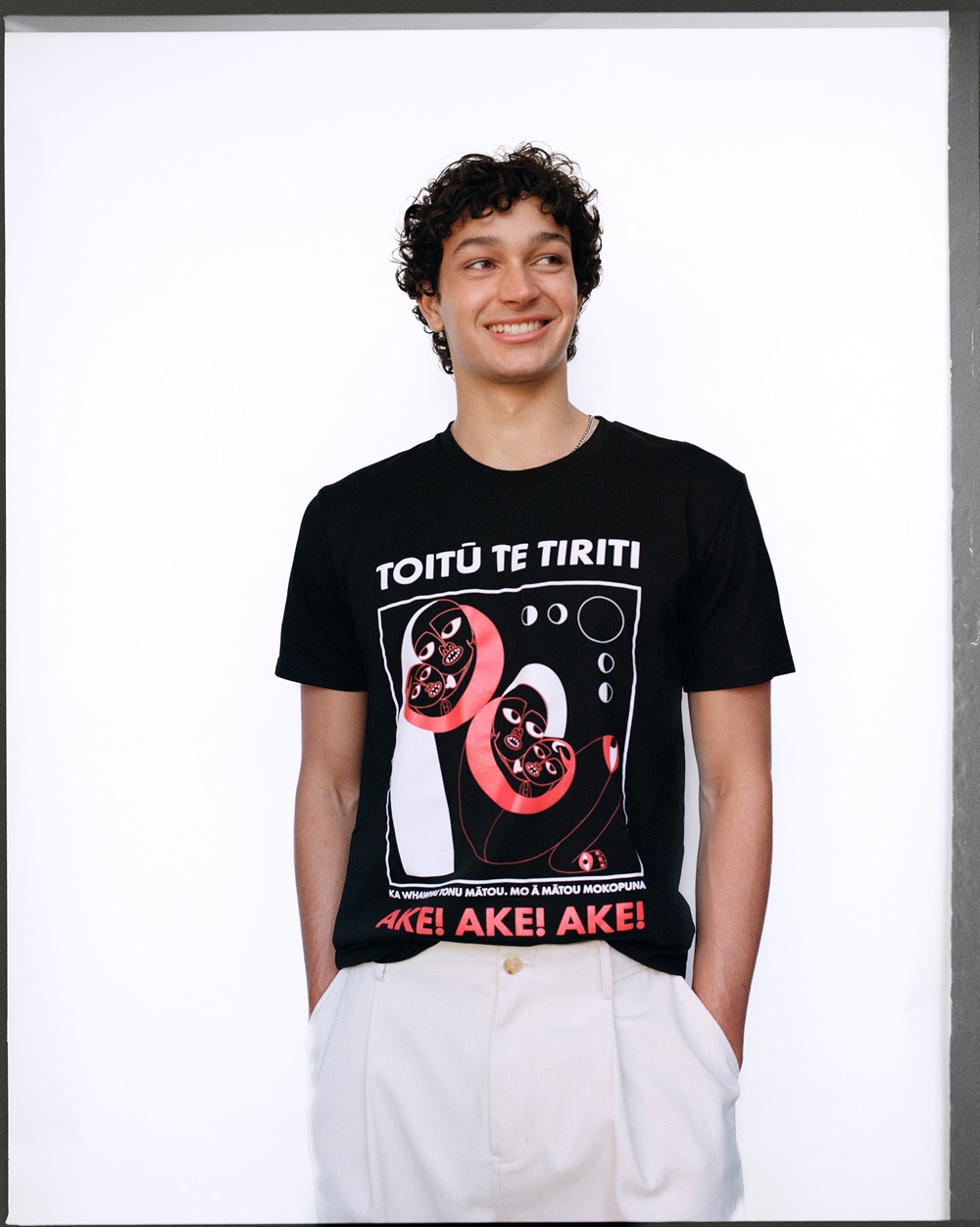 Noah Tumataroa wears Toitu te Tiriti Kaupapa Pakeke T-shirt by Melanie Tangaere-Baldwin from Moana Fresh, and Rory William Docherty trousers. Photo / Rob Tennent