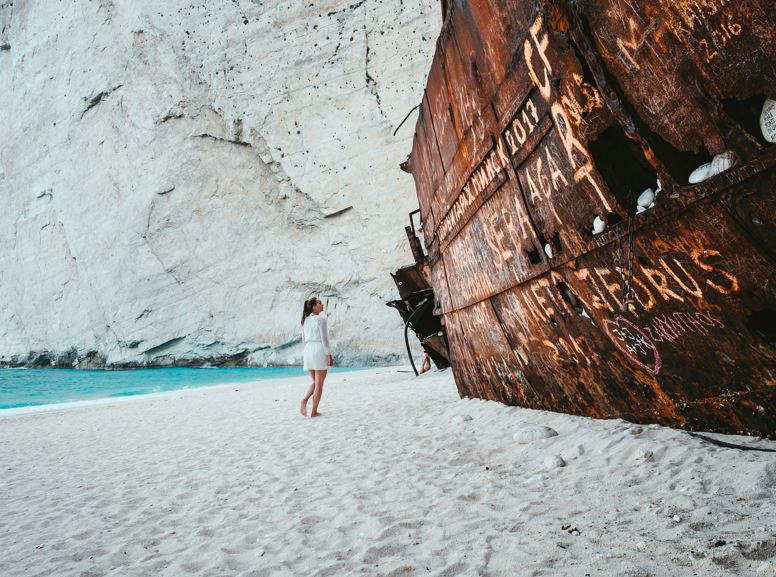 Enjoy the dramatic landscape of Navagio Beach (also dubbed Shipwreck Beach) in Zakynthos. Photo / Max van den Oetelaar on Unsplash
