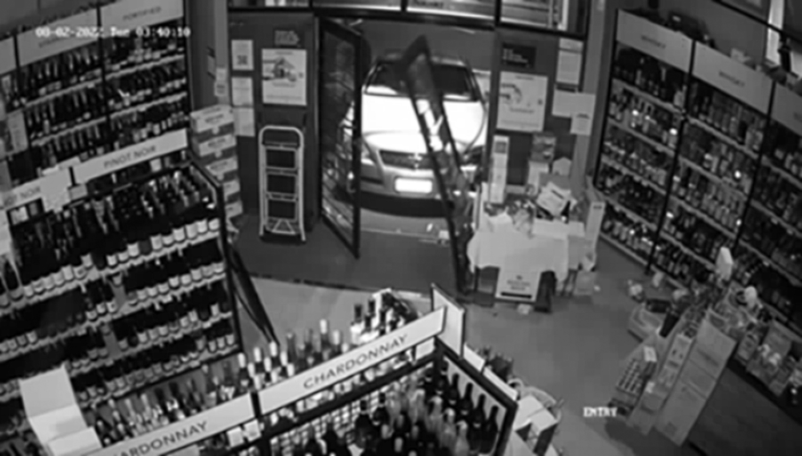 A ram raid at a bottle store captured on CCTV in Auckland. Photo / Supplied