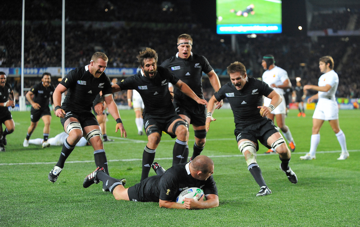 The All Blacks congratulate Tony Woodcock on his try during the 2011 final. Photo / Photosport