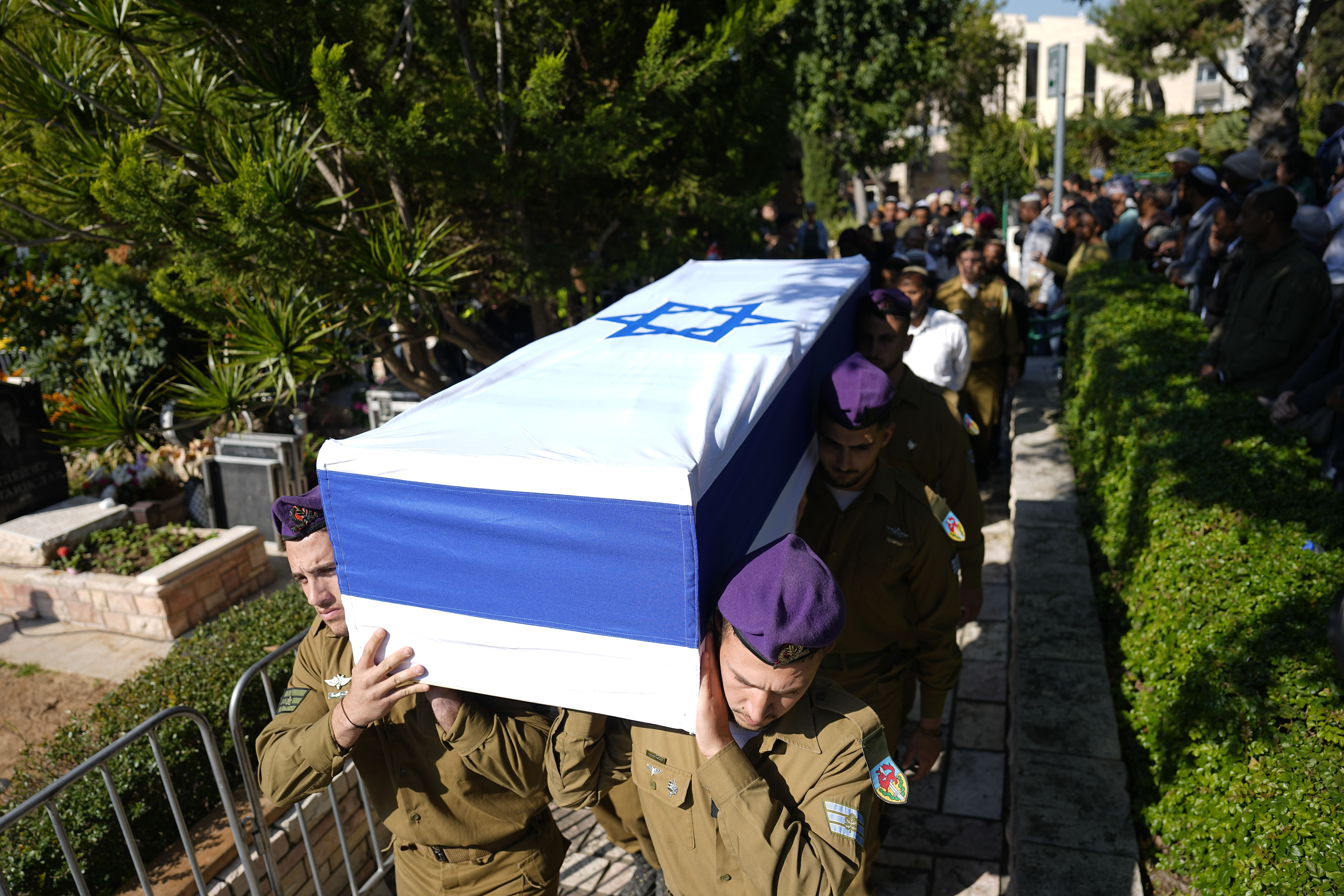 Israeli soldiers carry the casket of Staff Sergeant Narya Belete during his funeral in Netanya, Israel. Photo / AP