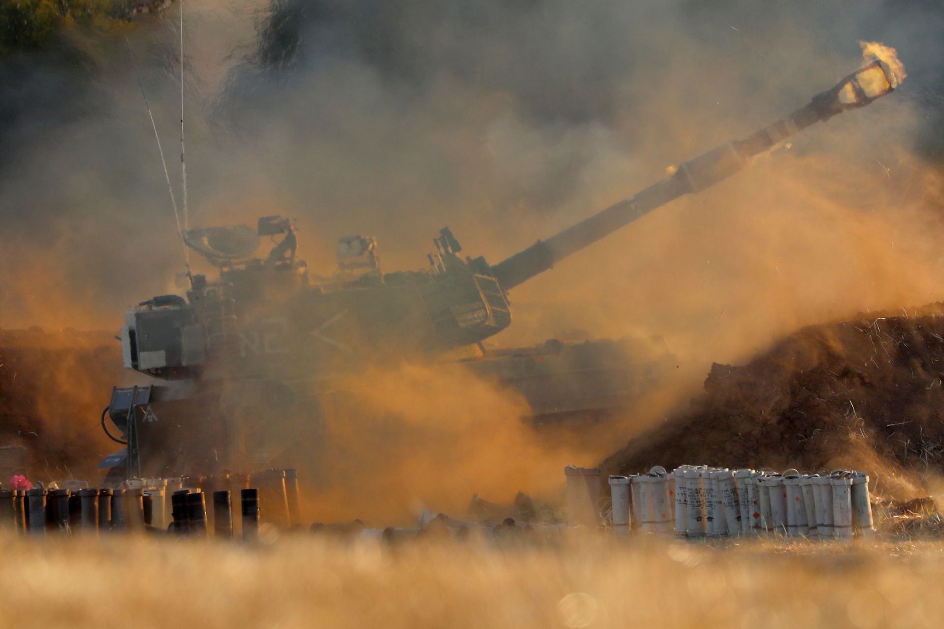 An Israeli artillery unit fires toward targets in Gaza Strip, at the Israeli Gaza border. Photo / AP