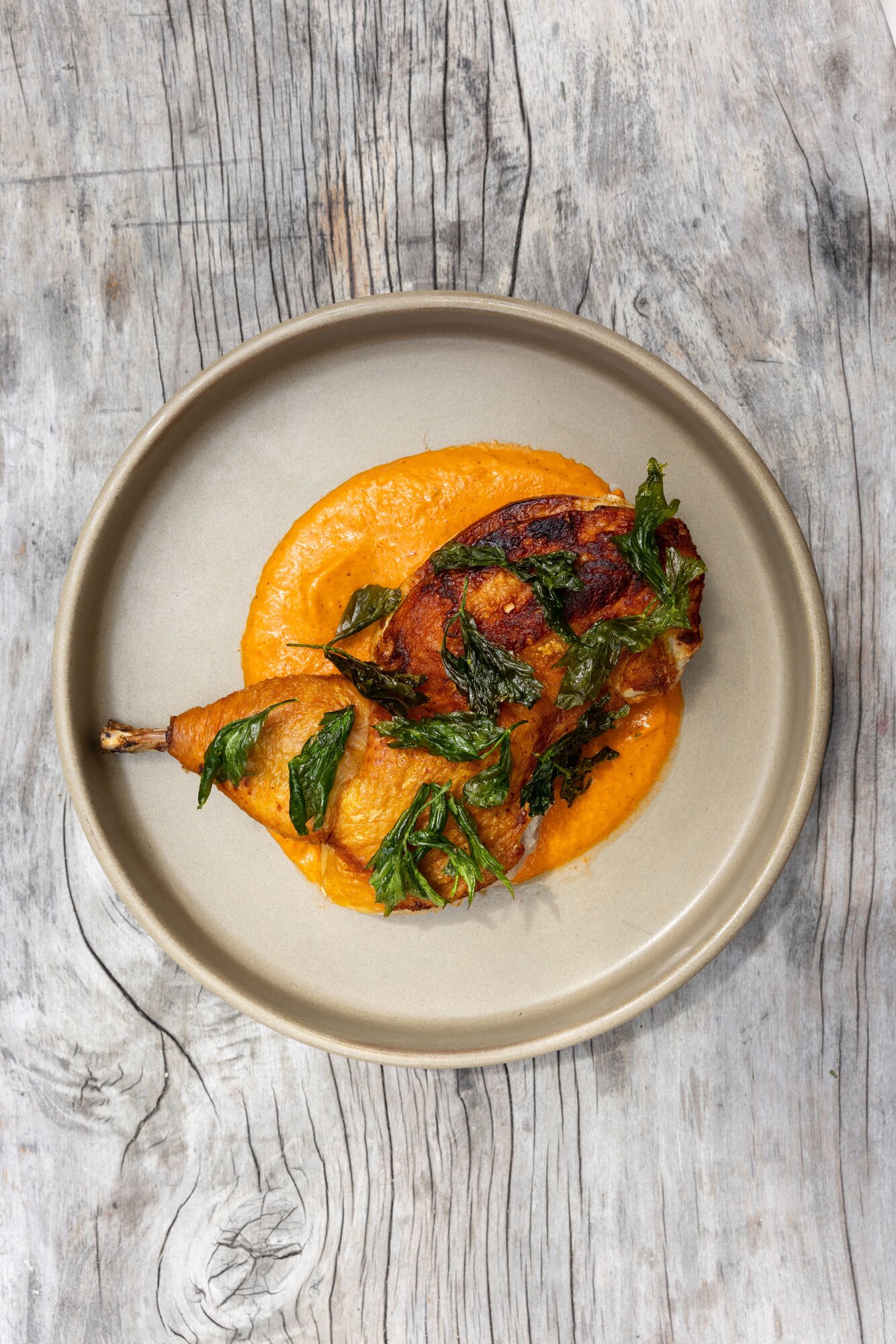 Organic half chicken, romesco, lovage from Sherwood.