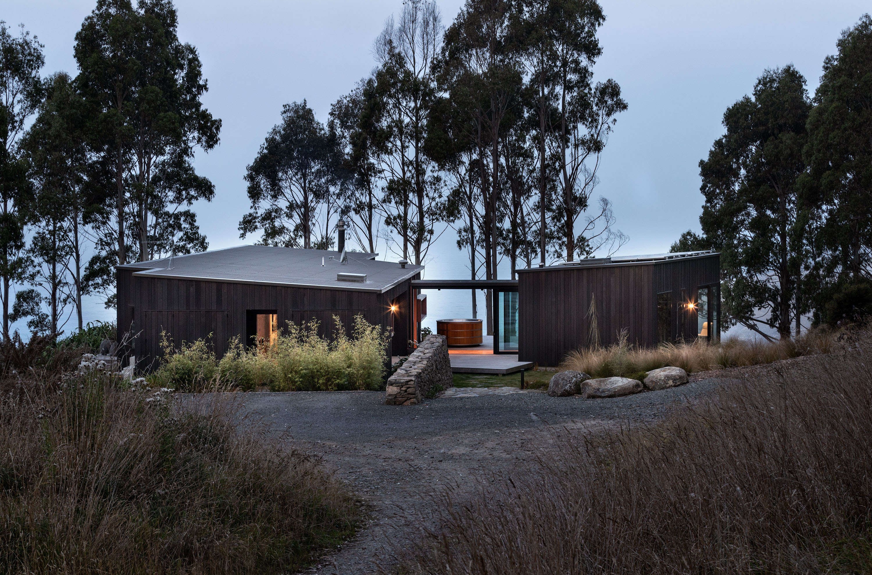 A landscape stair leads down to the house lawn and on to the entry deck. Photo / Simon Devitt
