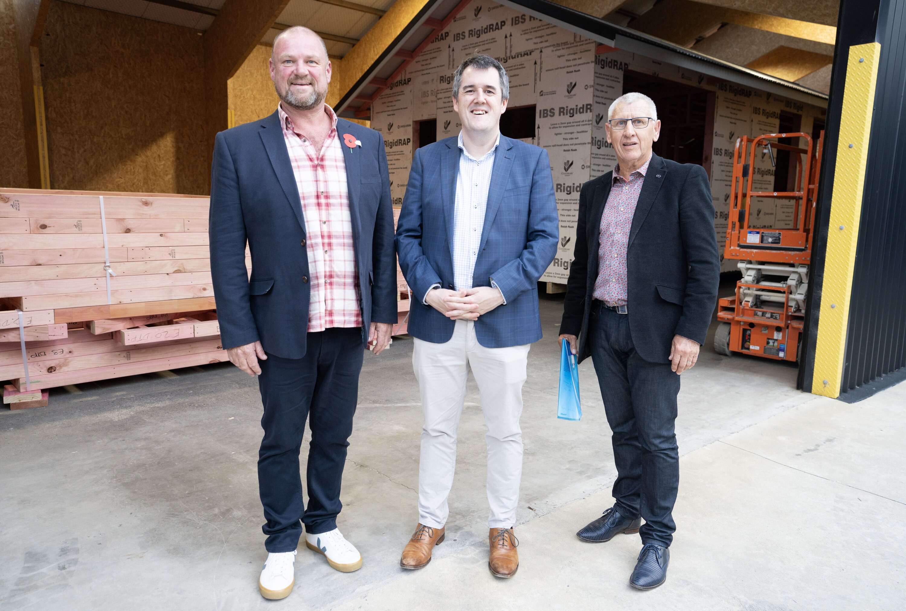 Todd Strode-Penny, director of TSP Construction, Minister Chris Bishop and Brendan Duffy, chair of the Horowhenua Company Ltd. Photo / Vicky Timpson