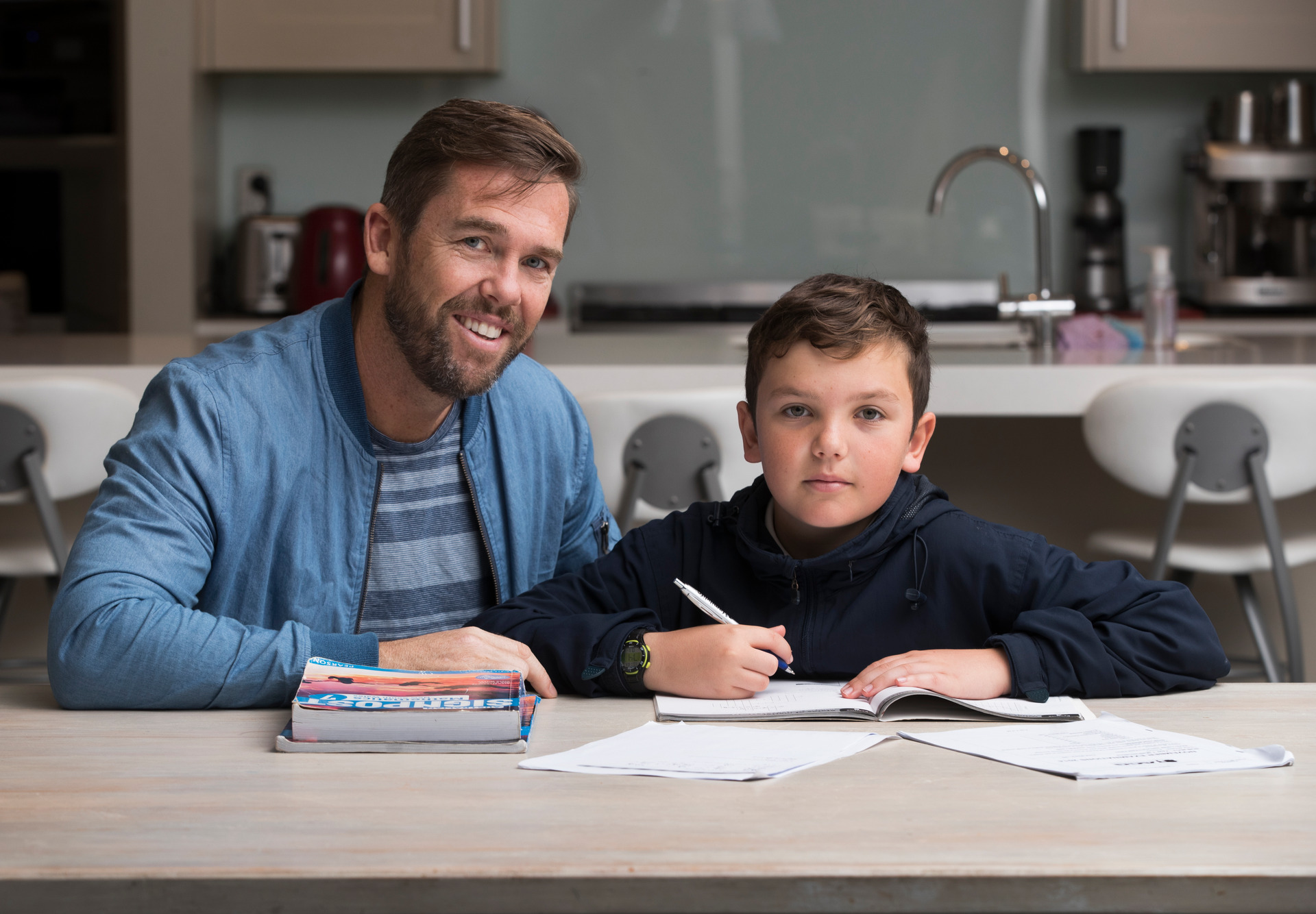 Greg Fleming, pictured with son Toby last year, says teachers have been underpaid for generations. Photo / File