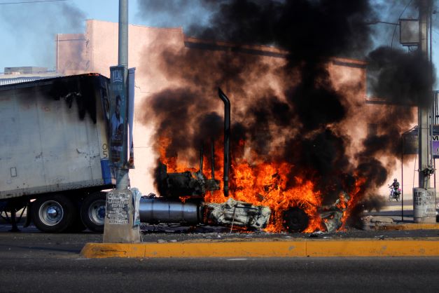 A truck burns on a street in Culiacan, Sinaloa state after Mexican security forces captured Ovidio Guzmán, an alleged drug trafficker wanted by the United States and one of the sons of former Sinaloa cartel boss Joaquín “El Chapo” Guzmán, sparking gunfights and roadblocks across the western state’s capital. Photo / AP