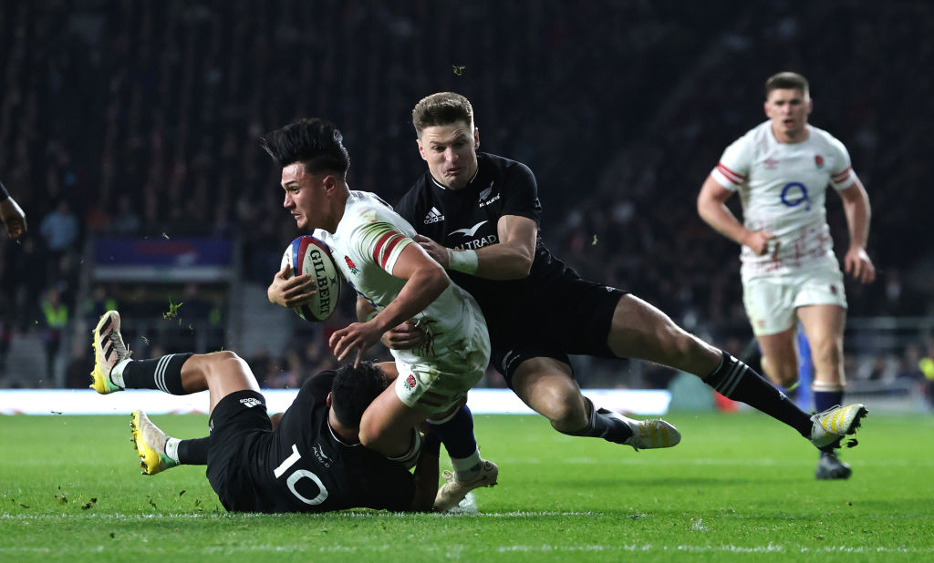 Marcus Smith of England is tackled during the 2022 draw between the All Blacks and England. Photo / Getty Images