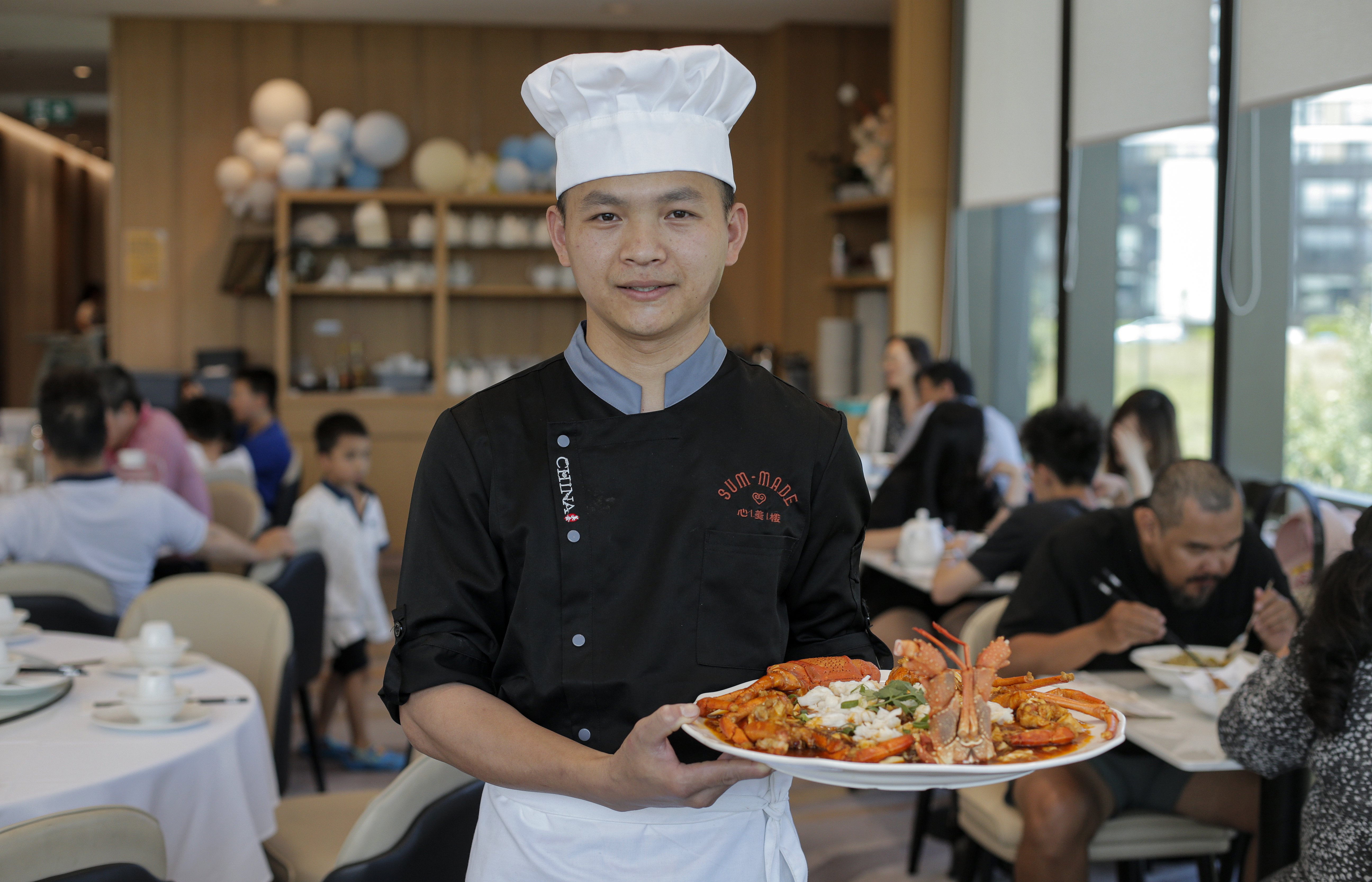 Chef Yuhua Xu of Sum Made Restaurant with crayfish made with a special mapo tofu sauce. Photo / Alex Burton