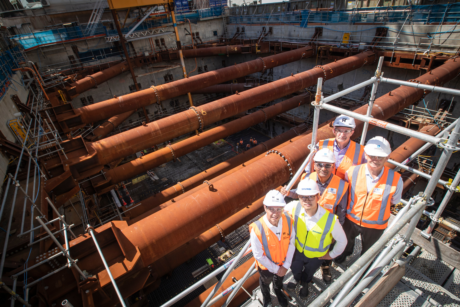 Nick Gillespie, Seascape engineering project director, Simon Ma, senior project manager, Sathy Thurai-rajah, construction manager, Bradley Luke, principal architect and Les Honeyfield, senior project manager at the site in 2019. Photo / Jason Oxenham

