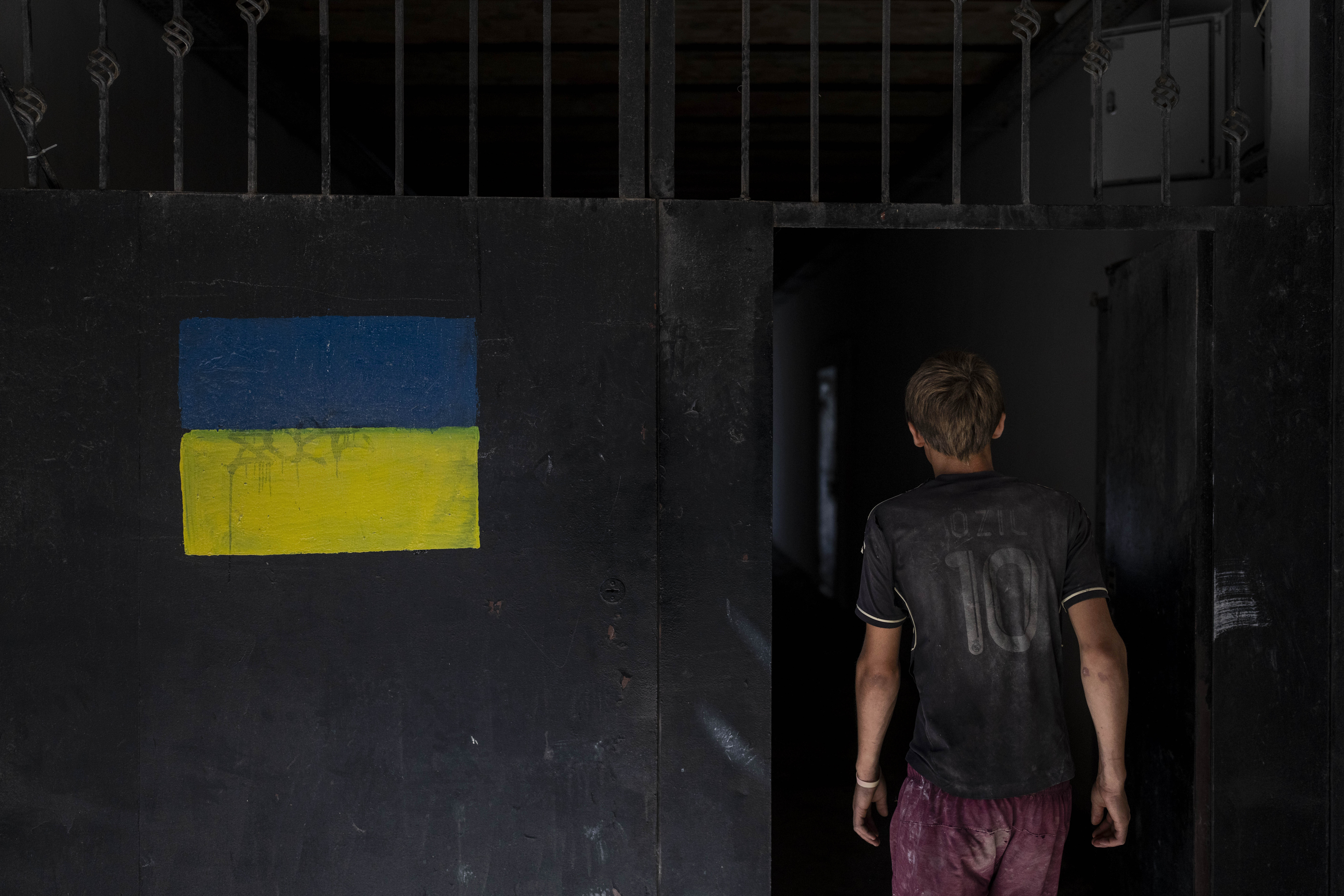 A damaged Odesa apartment building painted with the Ukrainian flag. Photo / AP