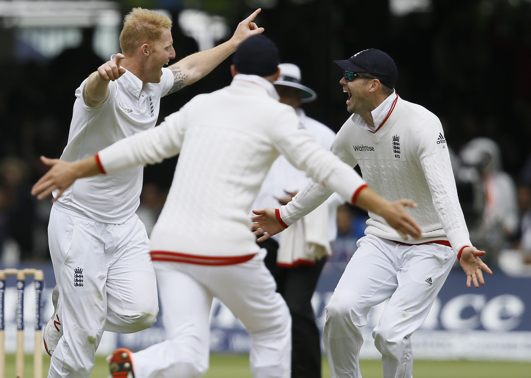 England's Ben Stokes, left, and James Anderson, right, celebrate taking the wicket of New Zealand's captain Brendon McCullum. Photo / AP