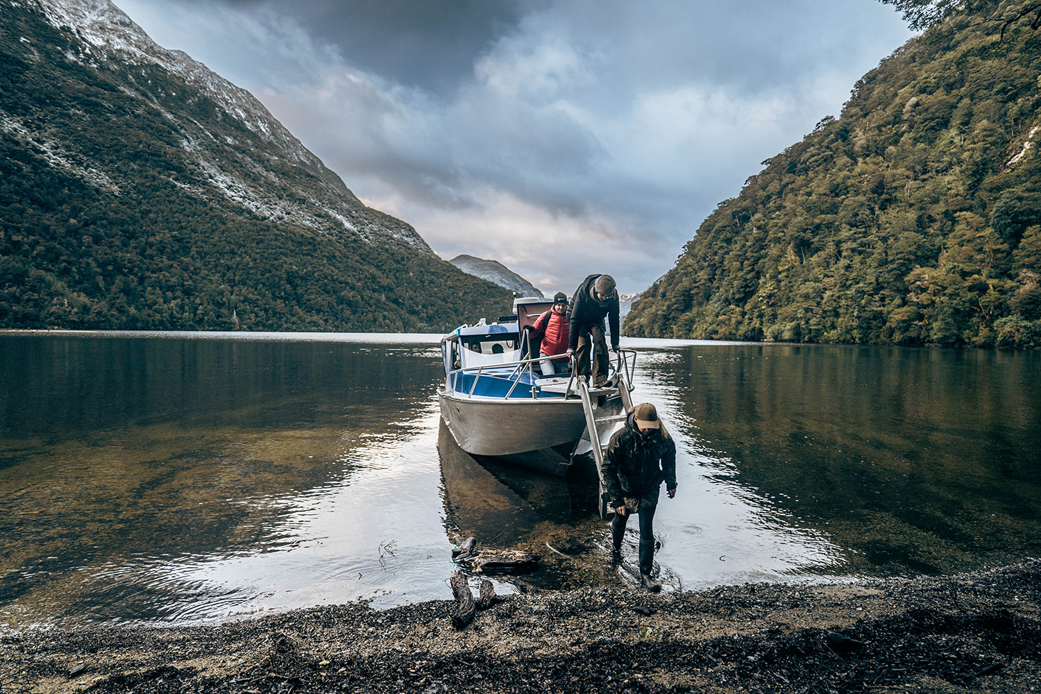 Jesse Mulligan, Helen Turnbull and Brittany Davies disembark in Fiordland. Photo / Johnny Hendrikus