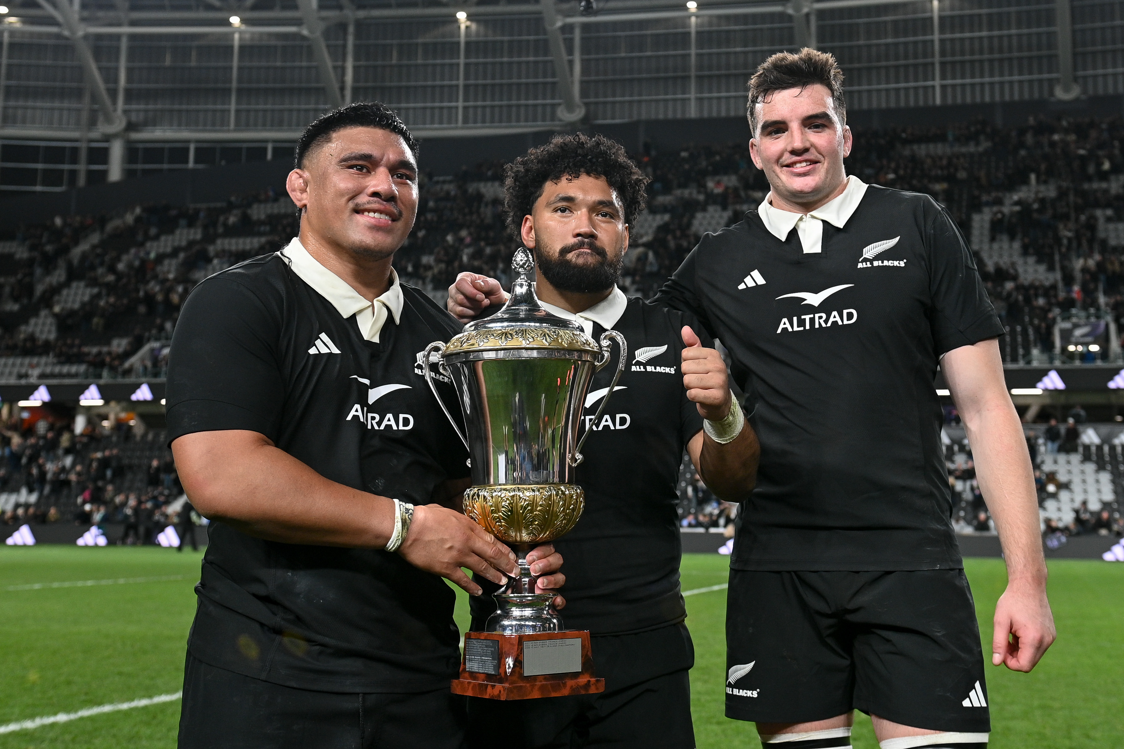 Xavier Numia (from left), Fehi Fineanganofo  and Jamie Hannah with the Dave Gallahe Trophy after the All Blacks' win over France. Photo / Photosport