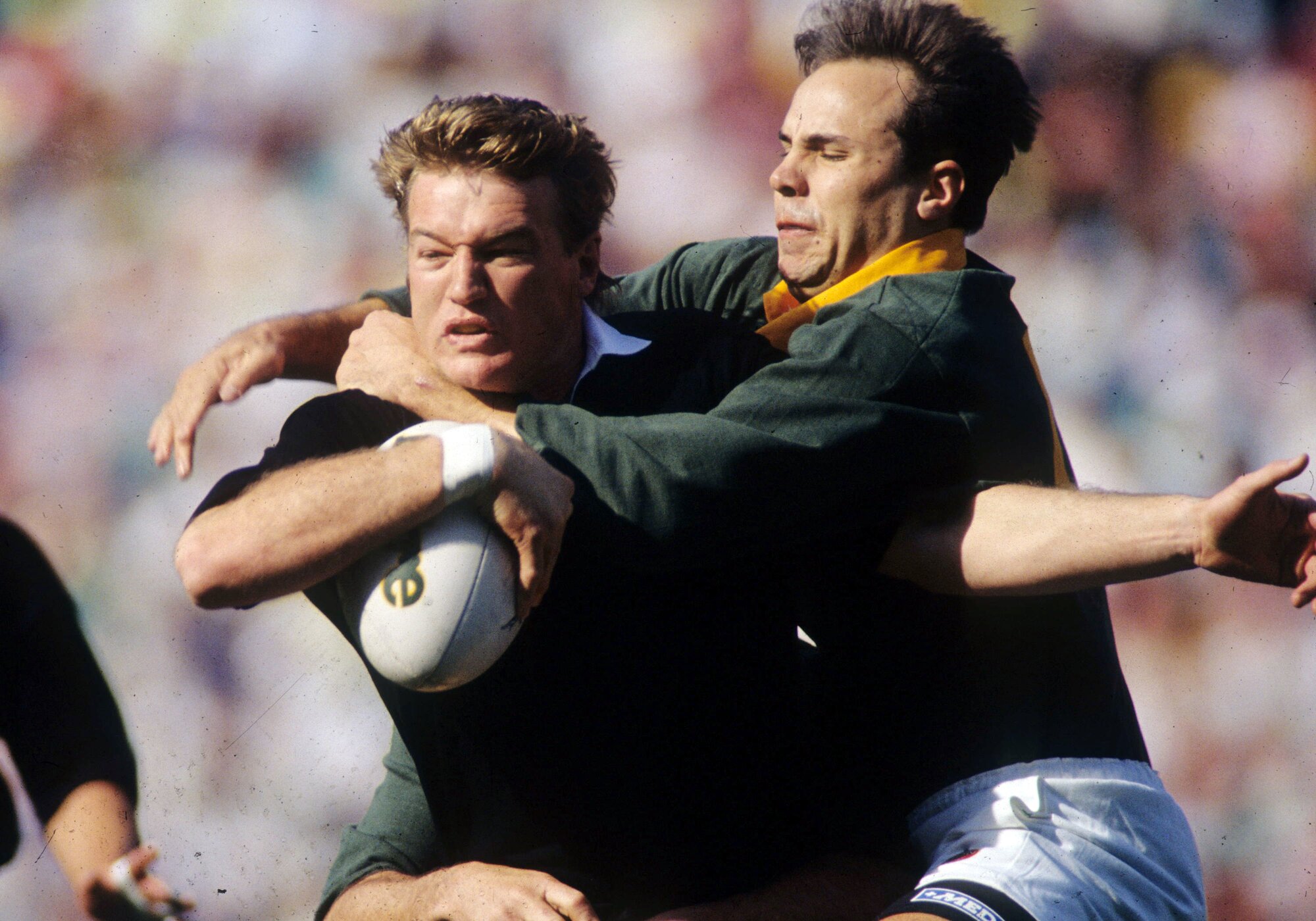 All Blacks winger Sir John Kirwan is tackled by South Africa's Danie Berger at Ellis Park. Photo / NZPA