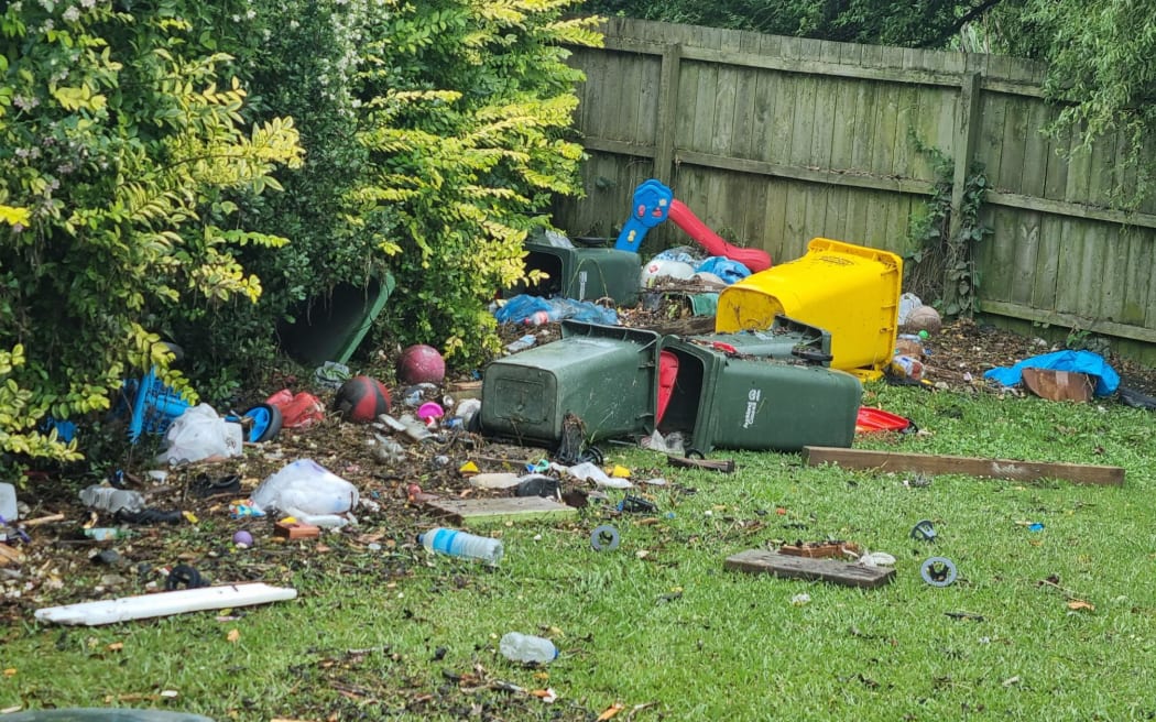 Debris heaped in a yard after the flood abated in Pito Pl, Māngere. Photo / Jonty Dine, RNZ