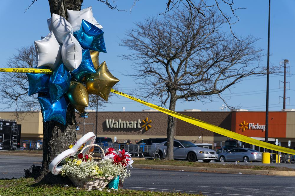 Flowers and balloons placed near the scene of a mass shooting at a Walmart in Virginia this week. Photo / AP