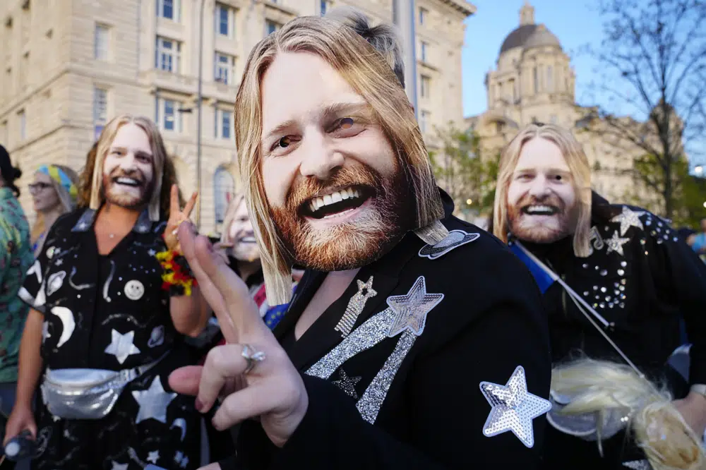 Viewers wearing Sam Ryder masks in the Fan Zone outside the Eurovision Song Contest in Liverpool. Photo / Jon Super, AP
